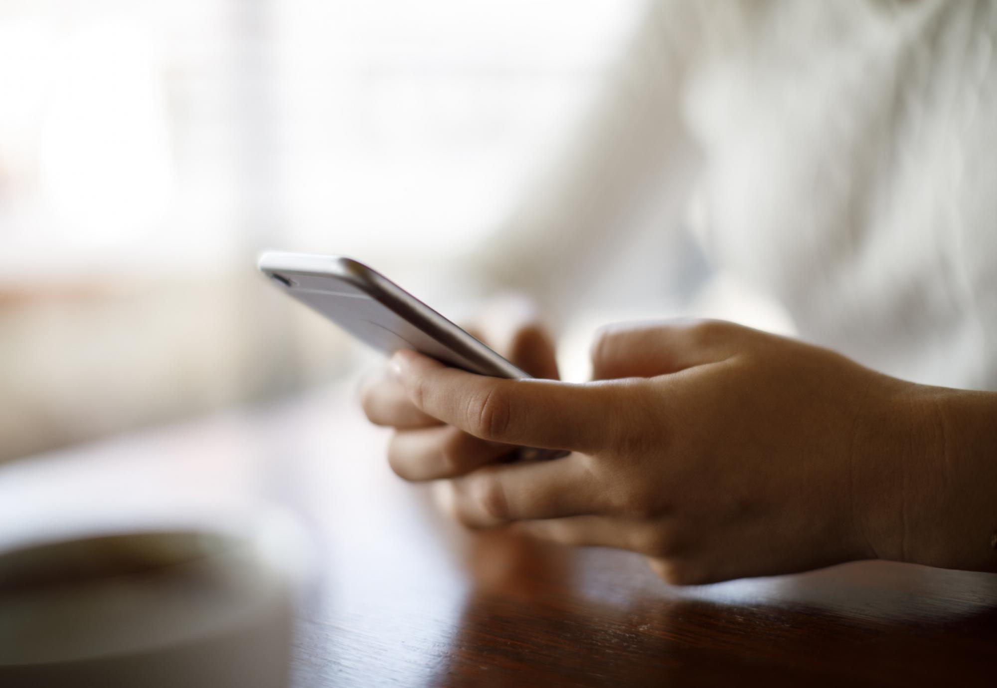 Person holding a mobile phone