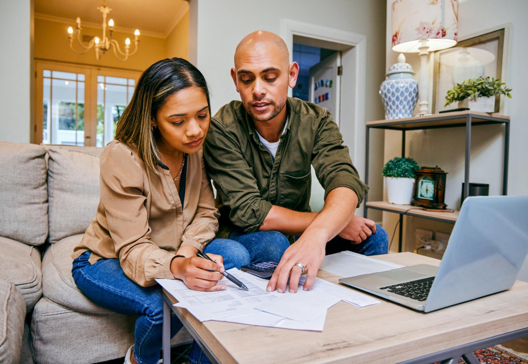 A couple looking through budgeting and bills