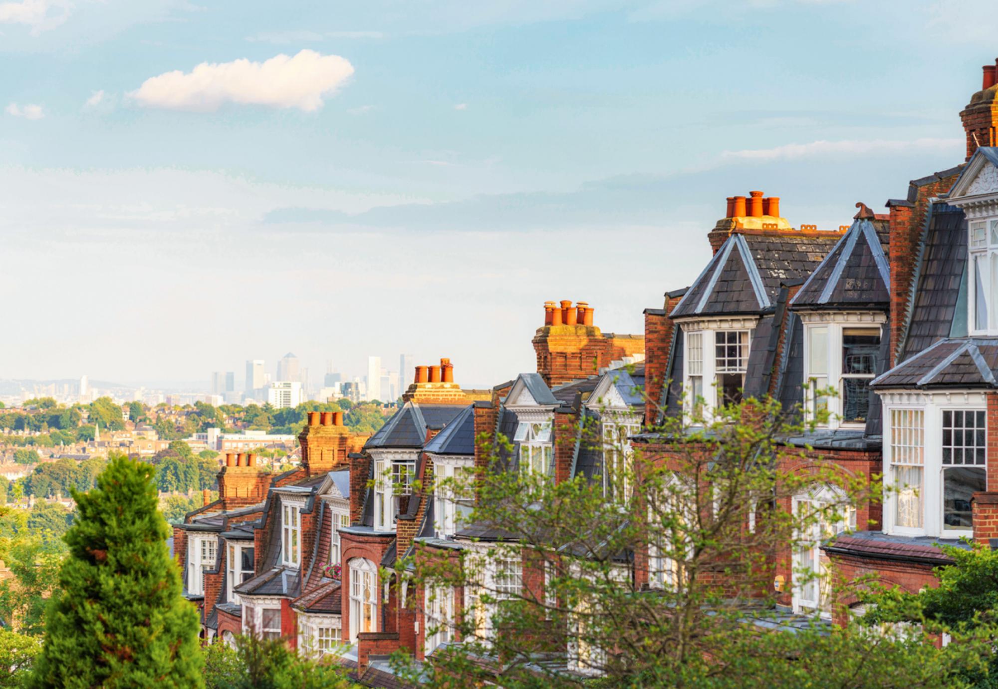 View of houses in London suburb, with Canary Wharf in the background