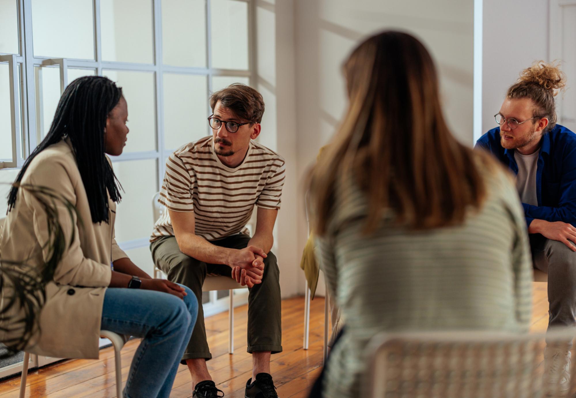 Group of people sat in a circle 