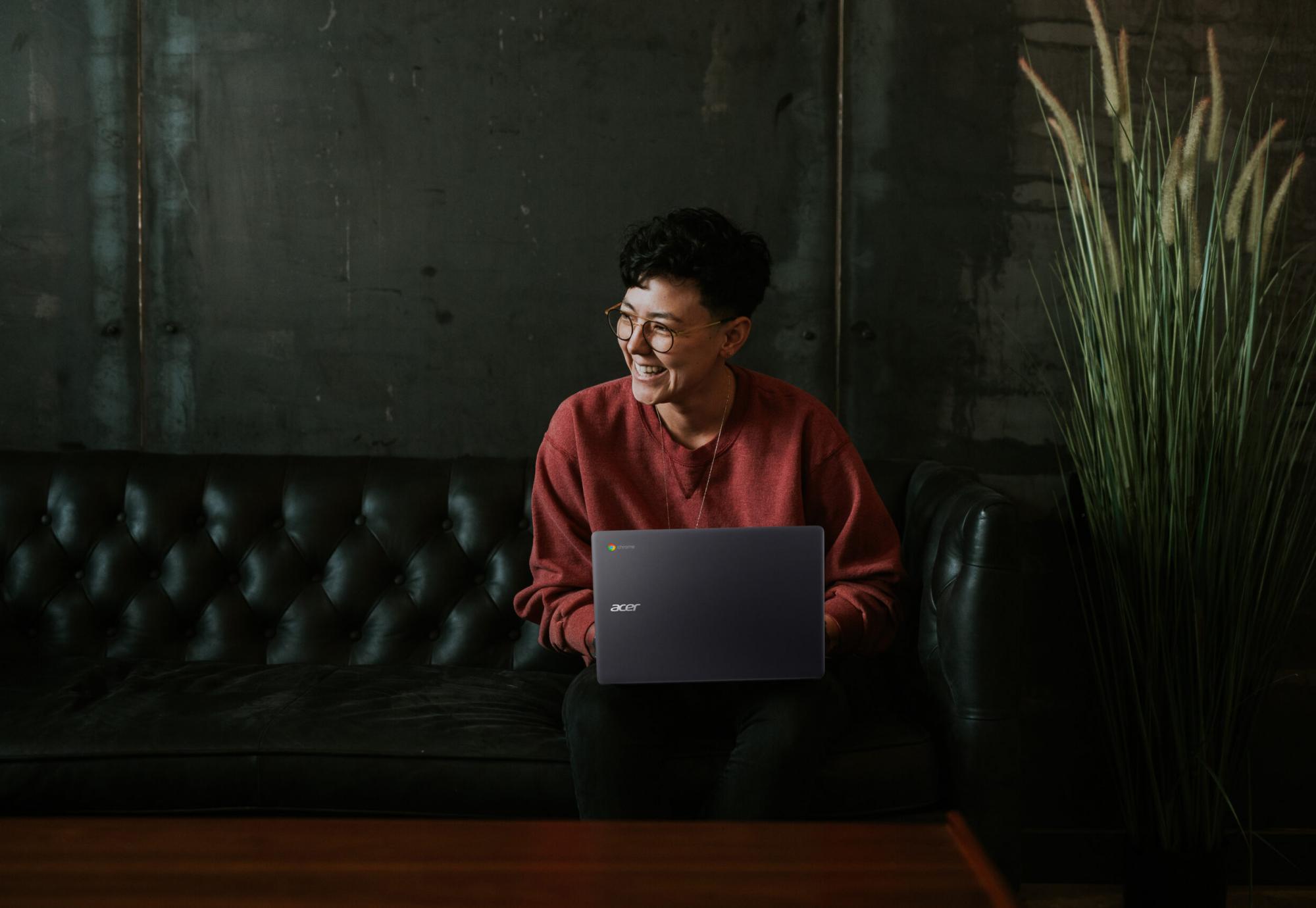 Woman sitting working on a laptop