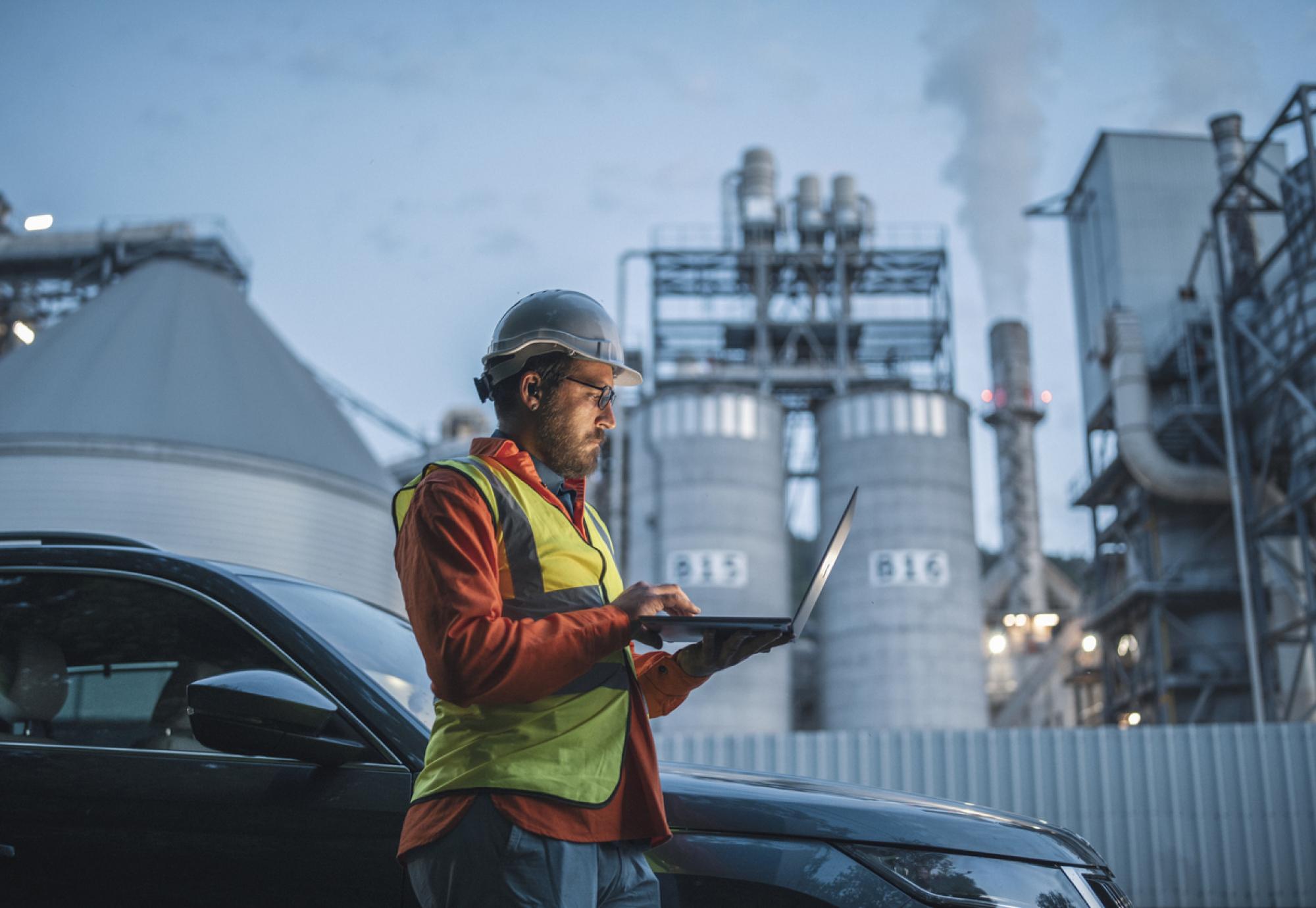 Man in front of power station