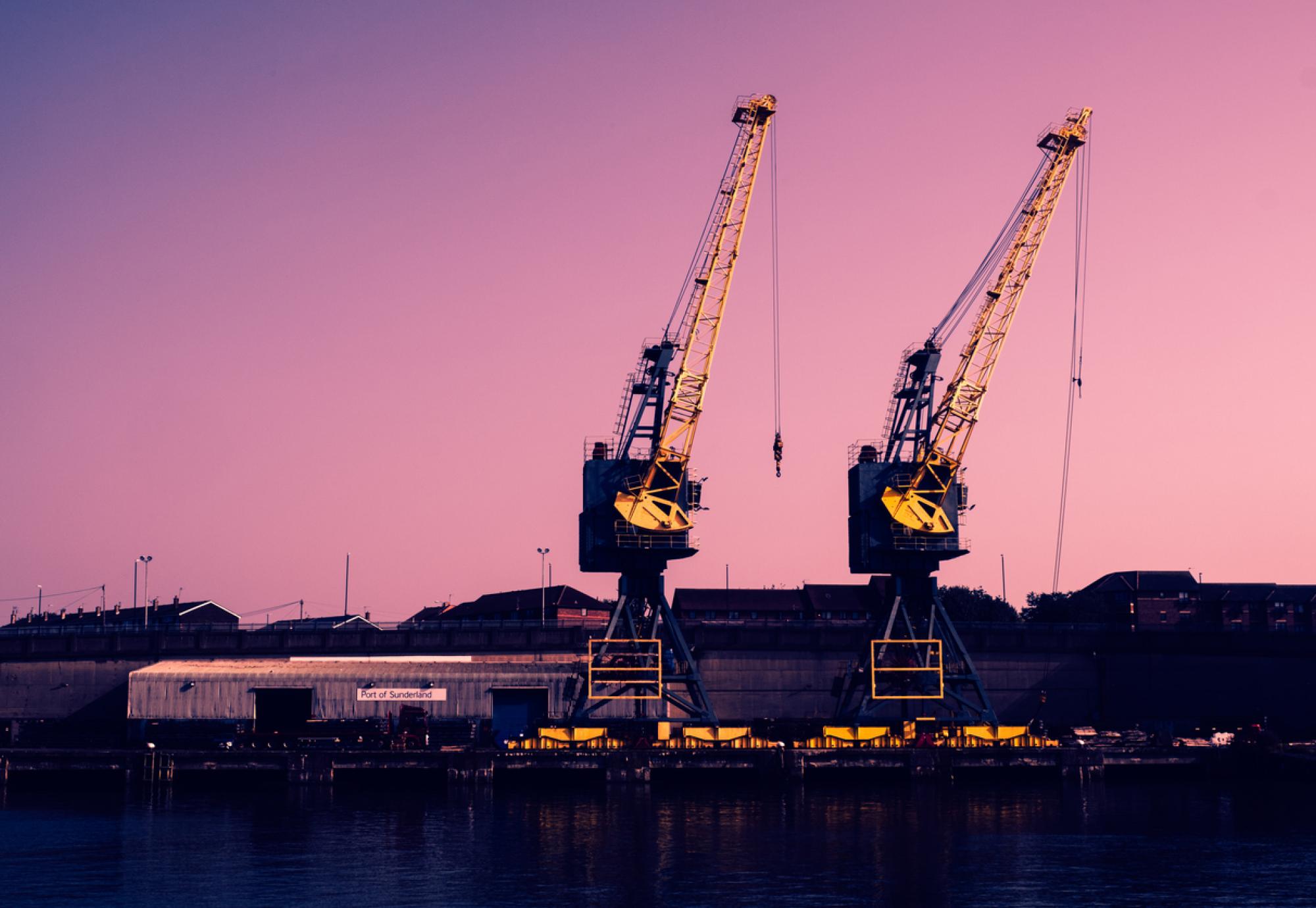 Two tall cranes on the banks of the River Wear in Sunderland, England.