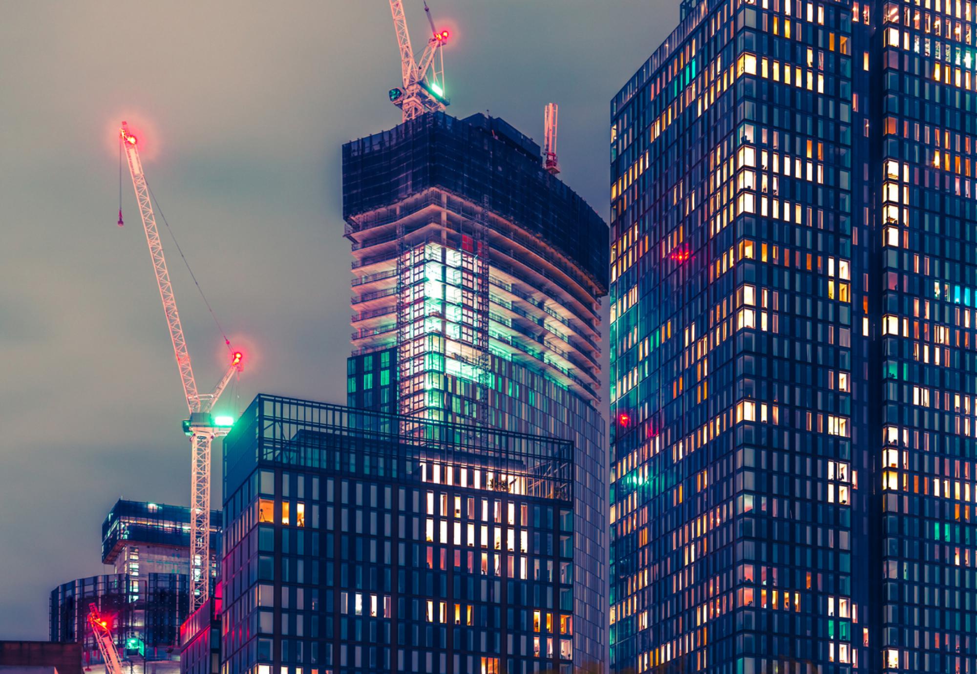 Tall buildings at night in Manchester