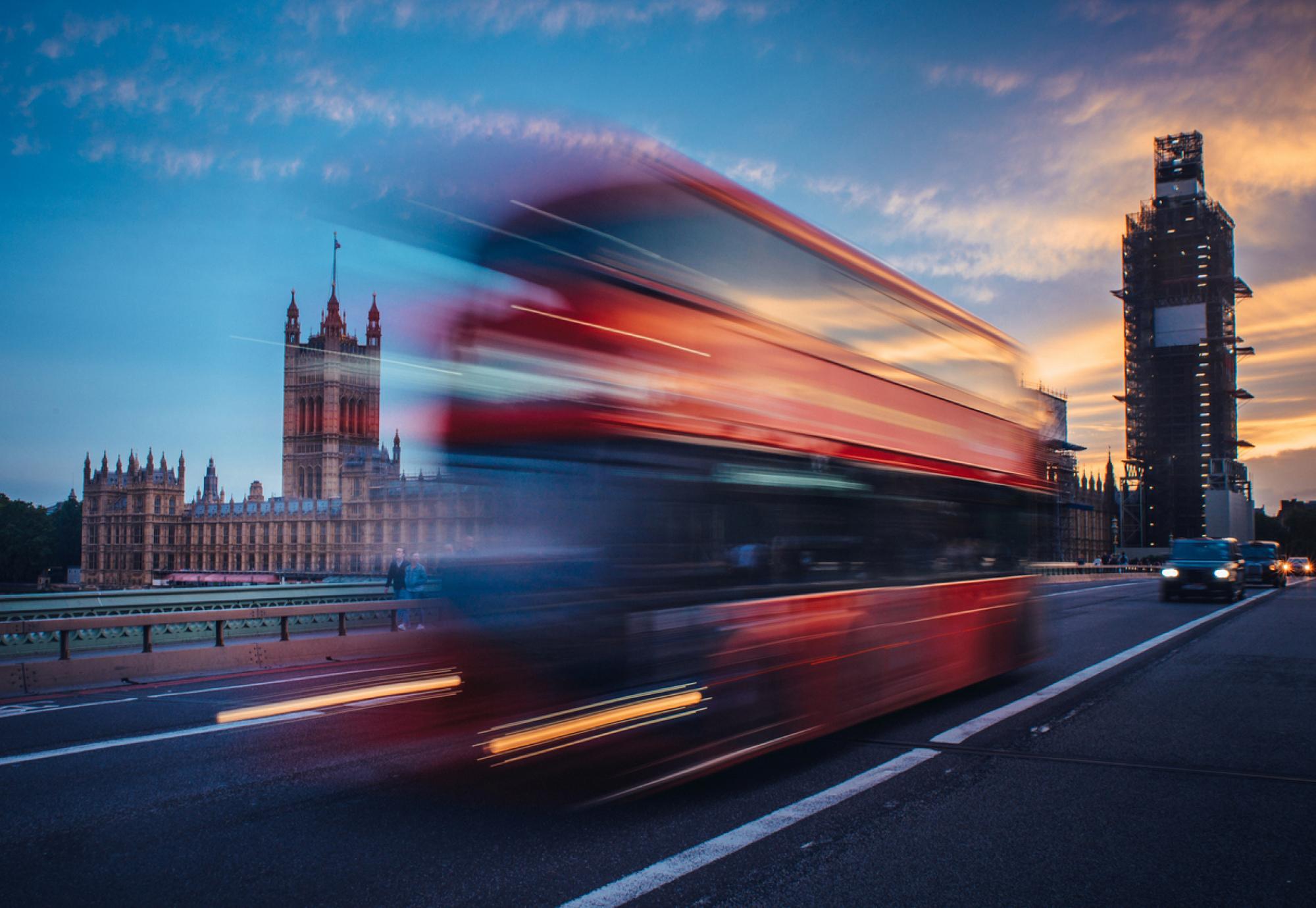 bus crossing westminster bridge in london