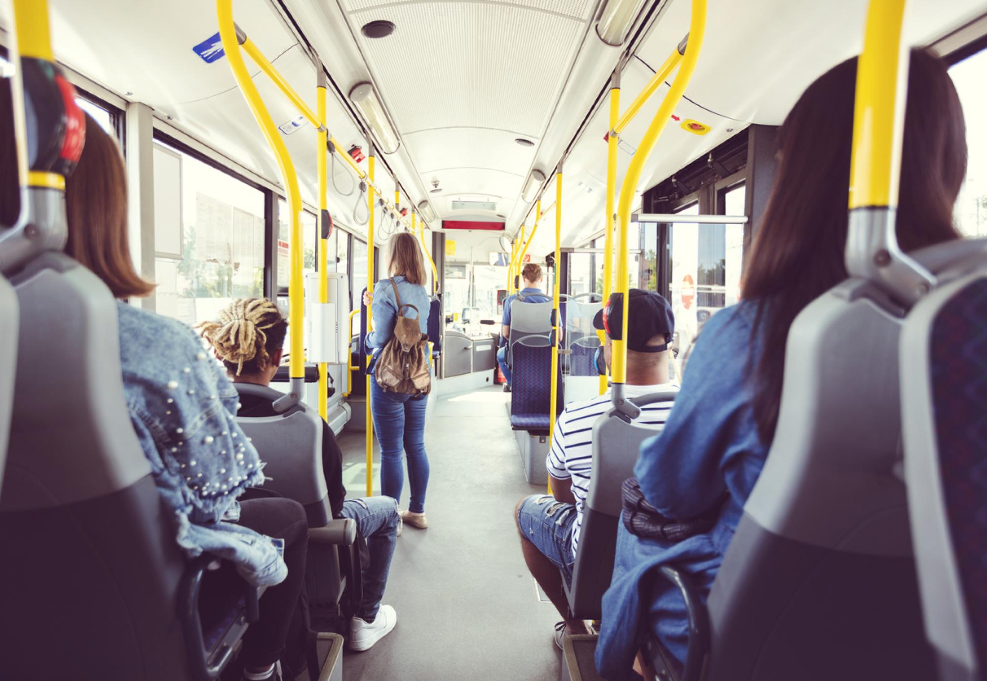 Group of people travelling on a UK bus