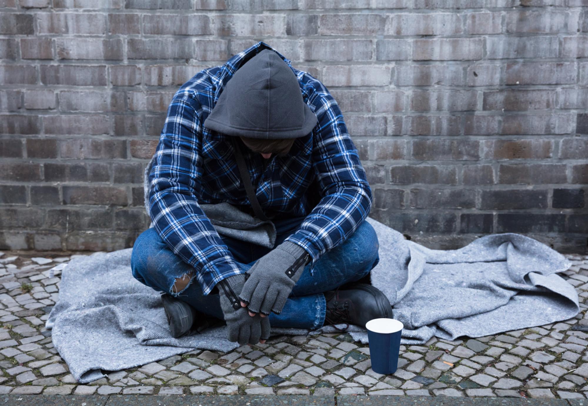 Beggar Sitting On Street stock photo