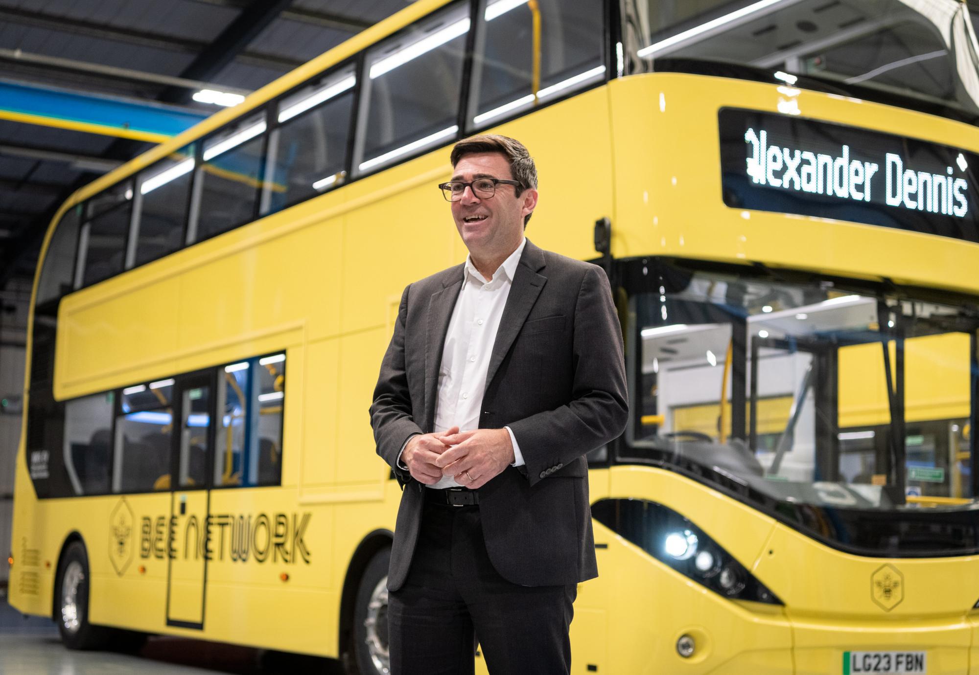 Andy Burnham with one of the buses