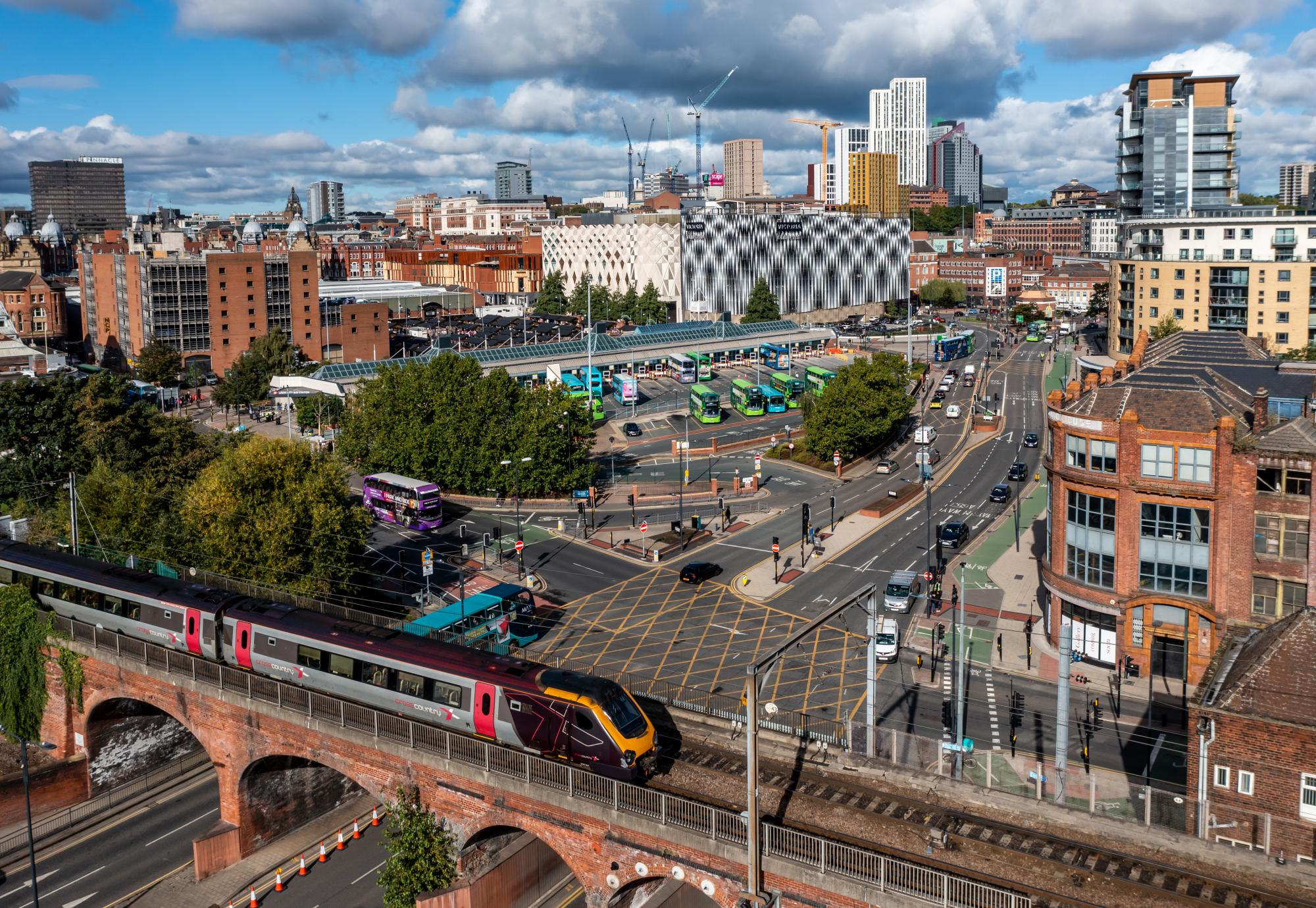 Aerial view of Leeds with train in foreground