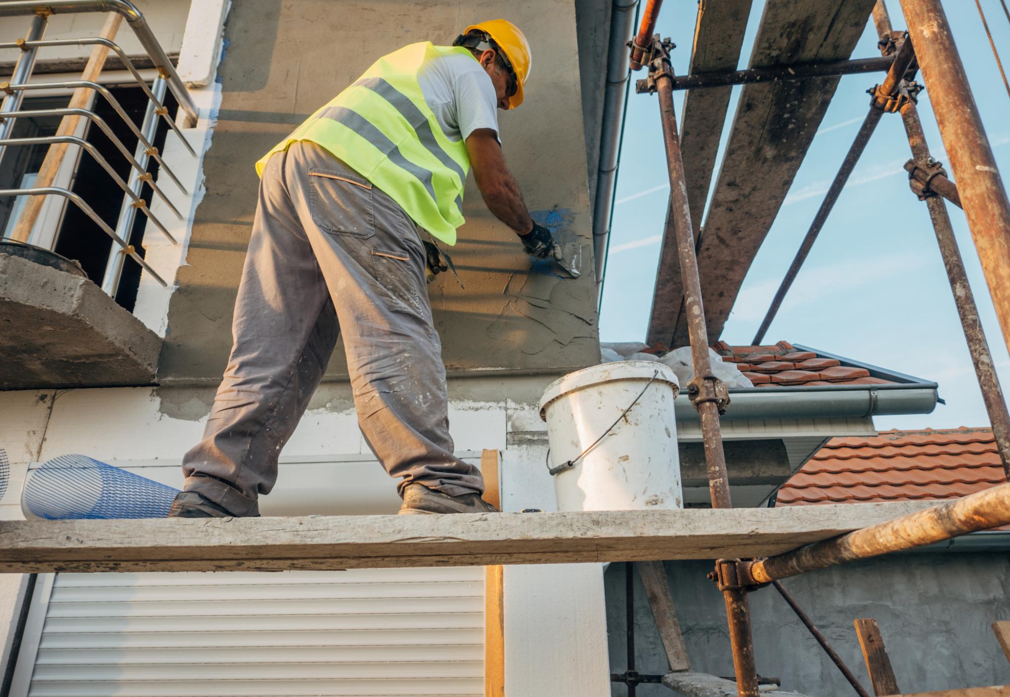 Man building an affordable house in West Sussex