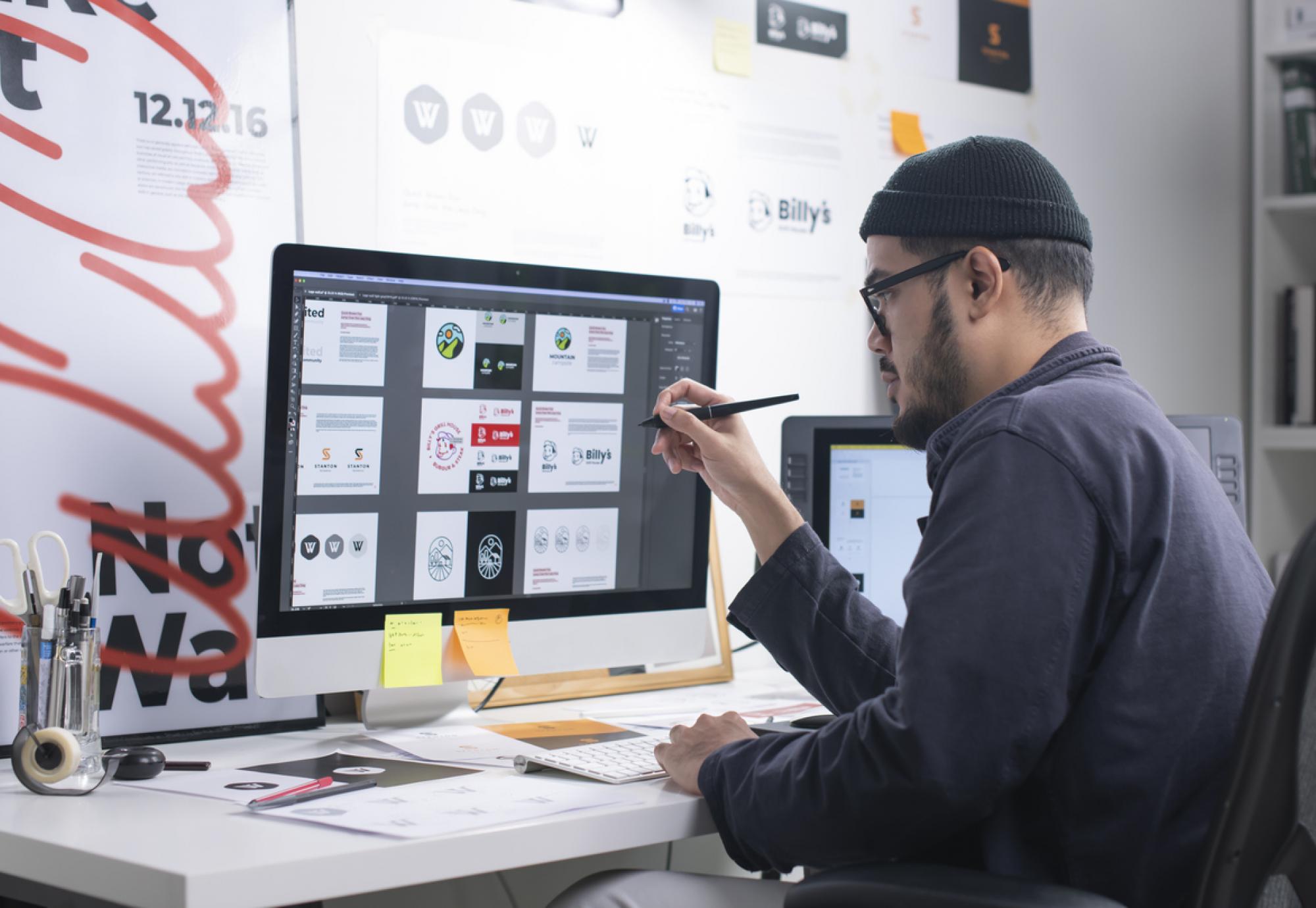 Man using a computer to create something