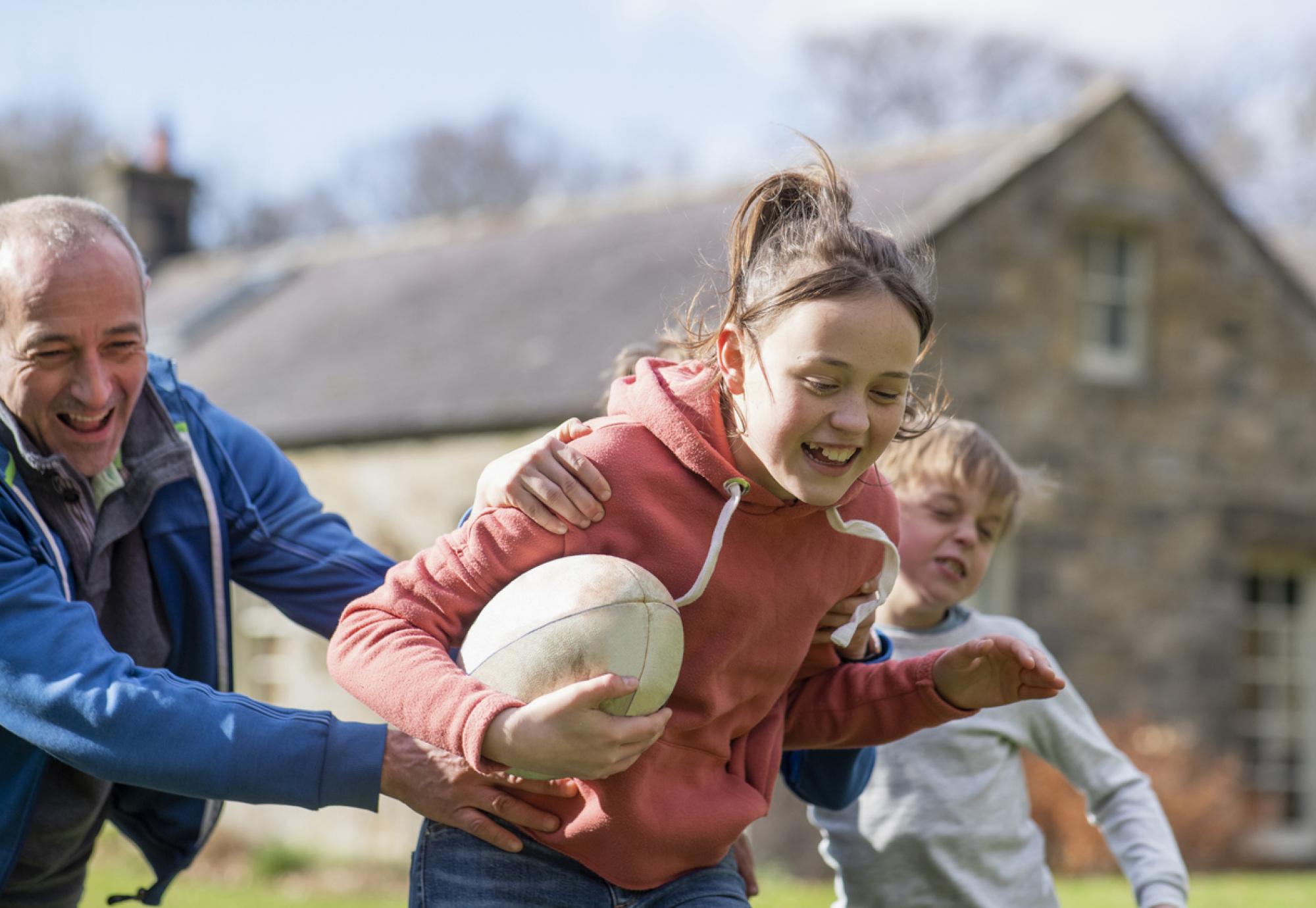 Kids playing rugby during the summer holidays