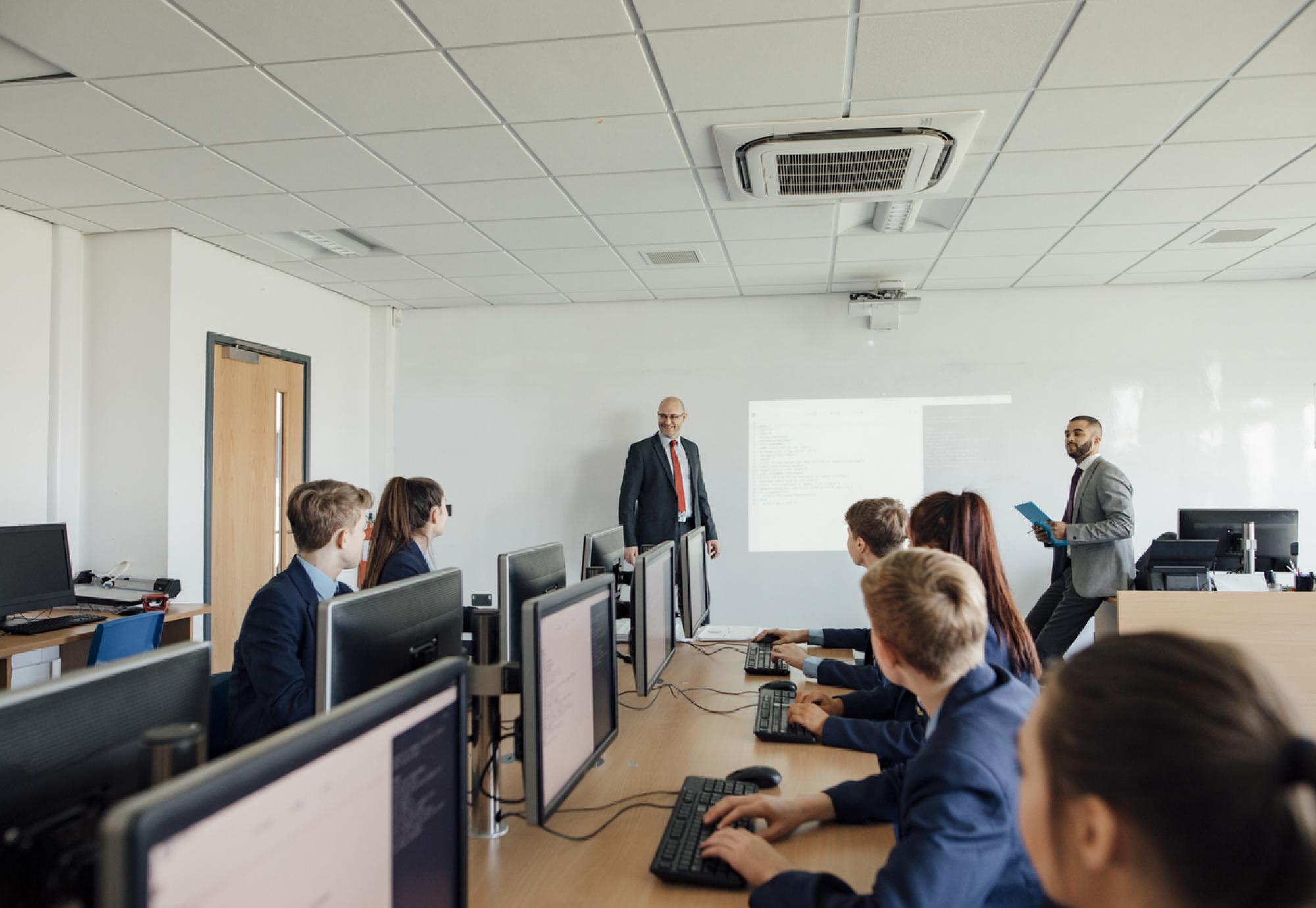 Pupils sat working on computers in a classroom