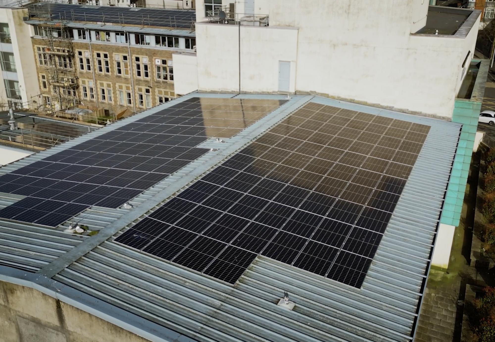 Image of some EDF solar panels on the roof of a university building