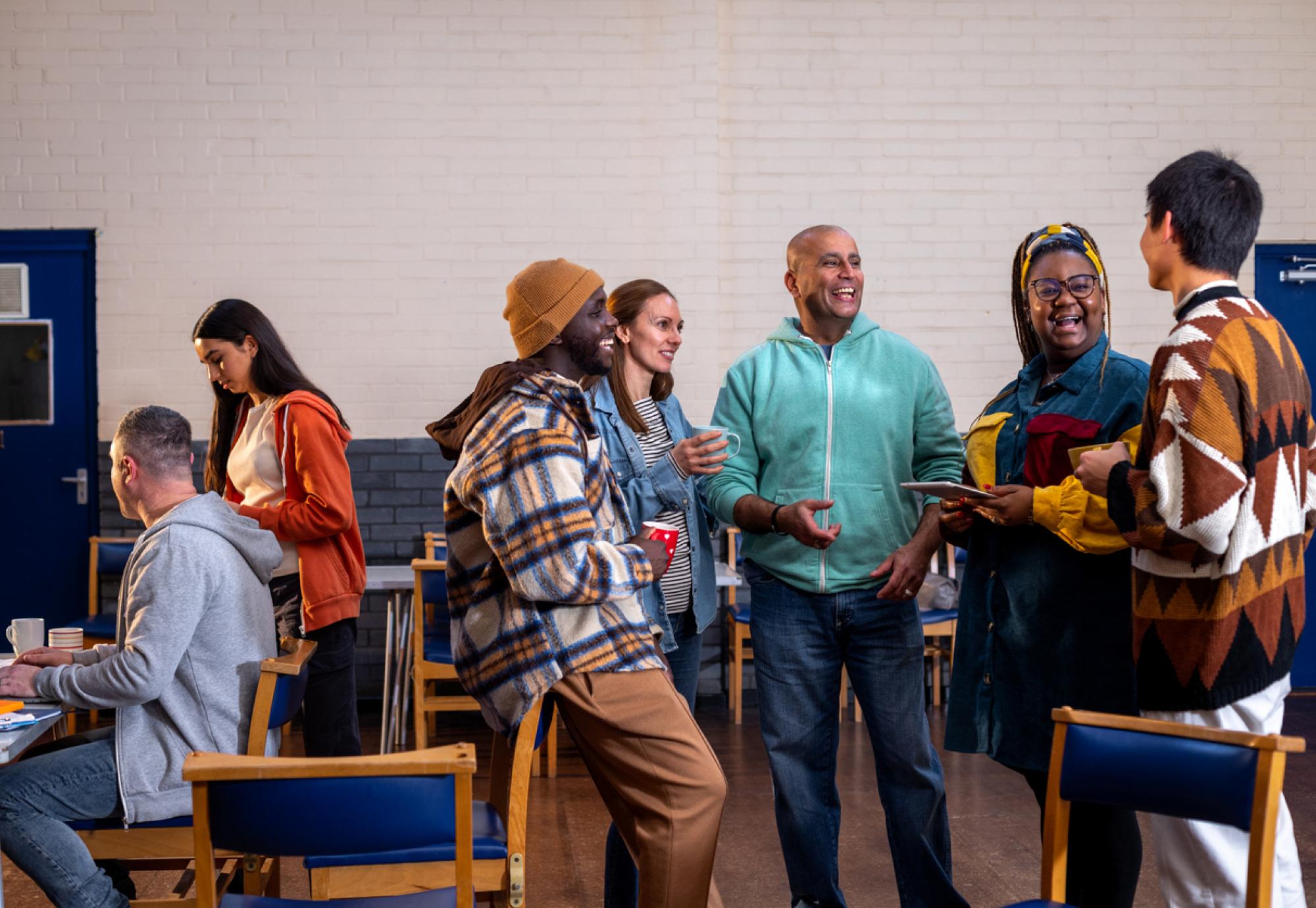 People socialising in a community centre in England