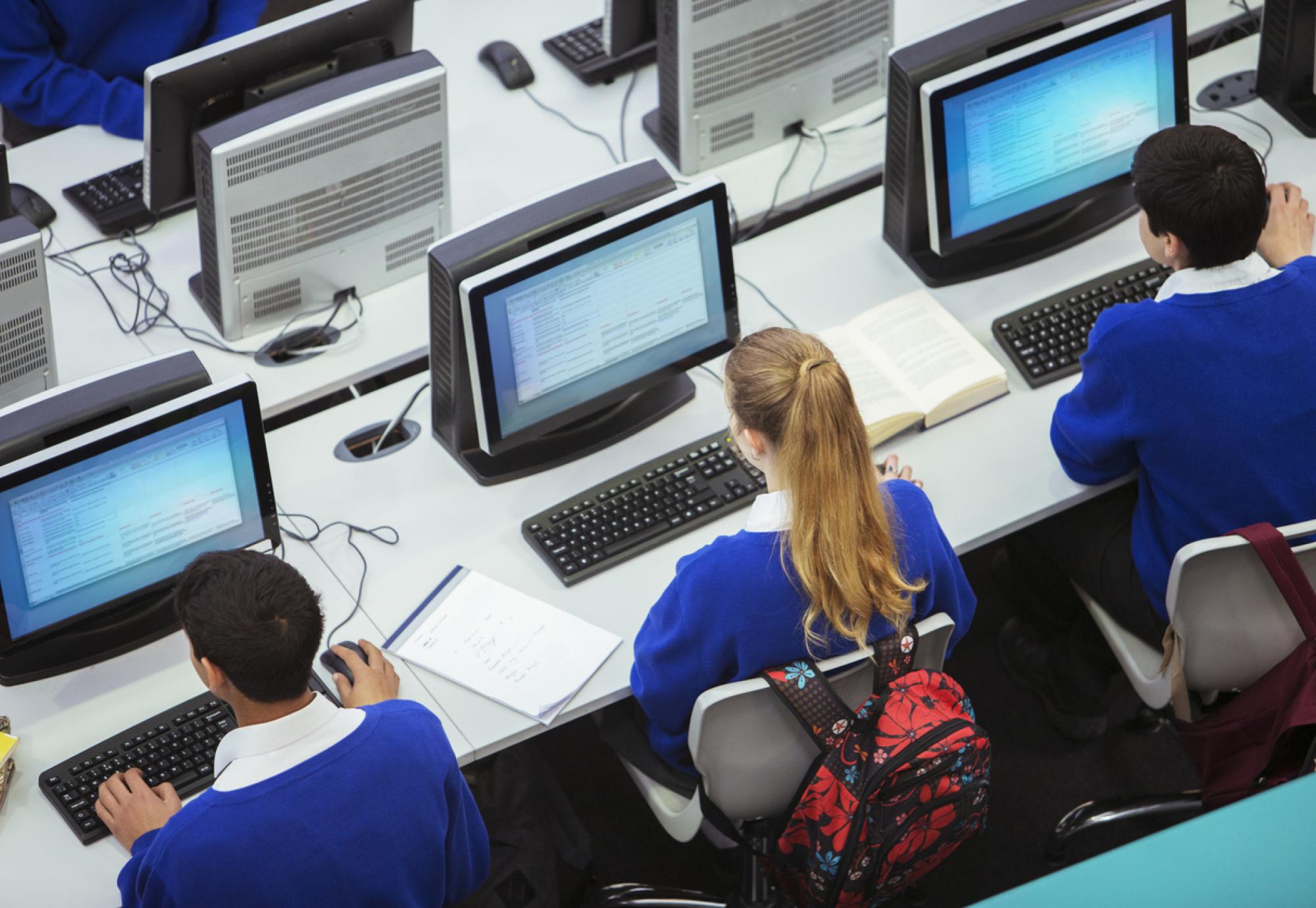 Pupils sat working on computers in a classroom