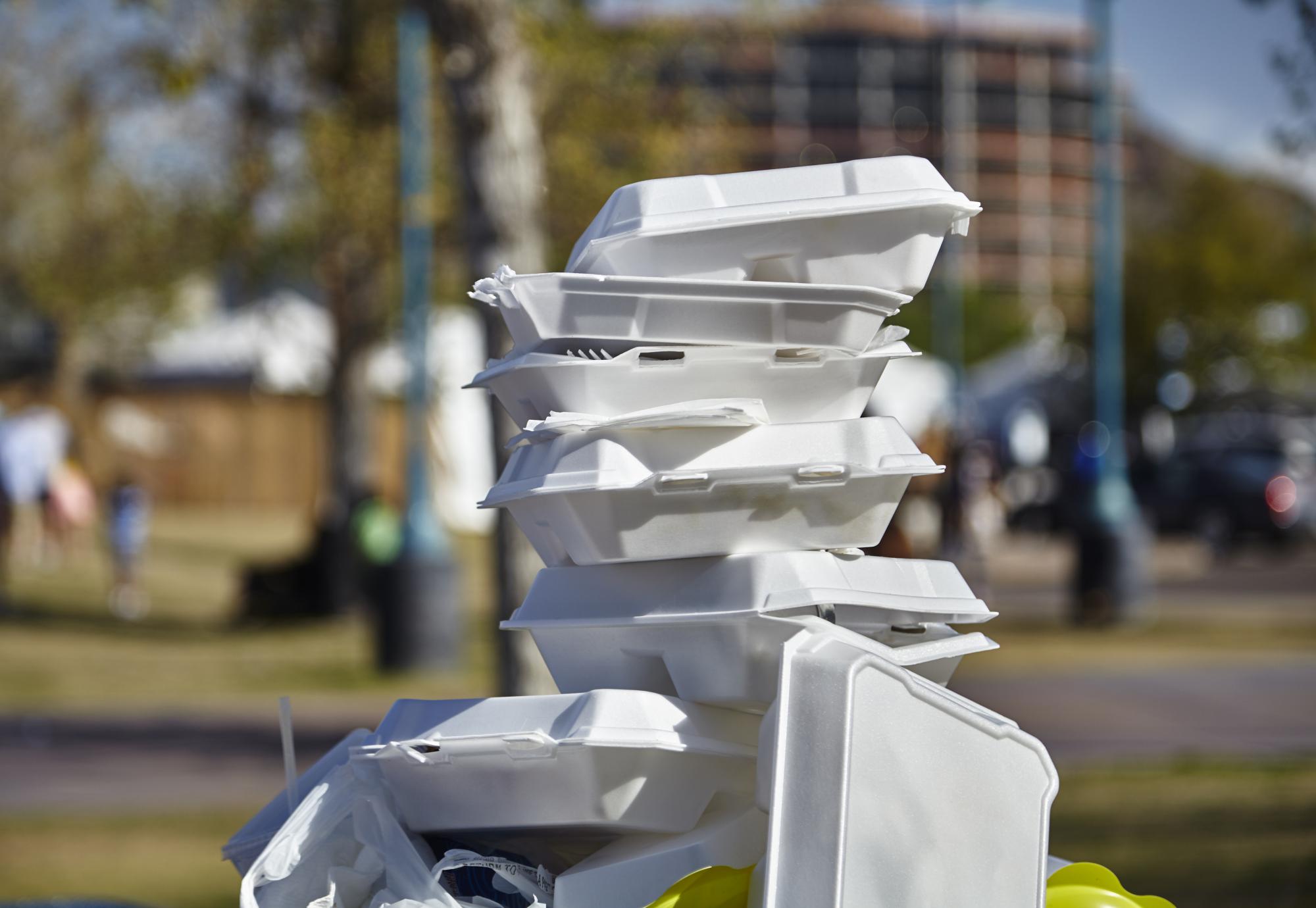 A pile of single use plastic boxes