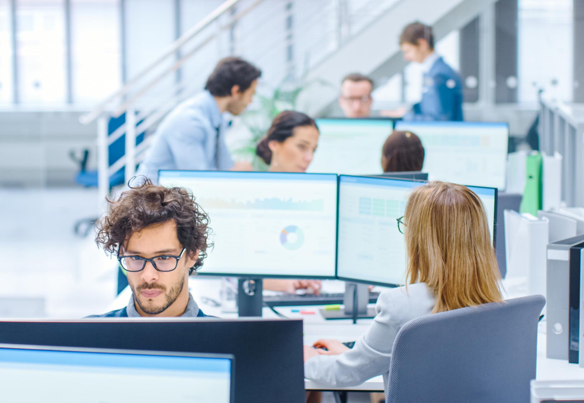 Big Busy Corporate Office with Two Rows off Businessmen and Businesswomen