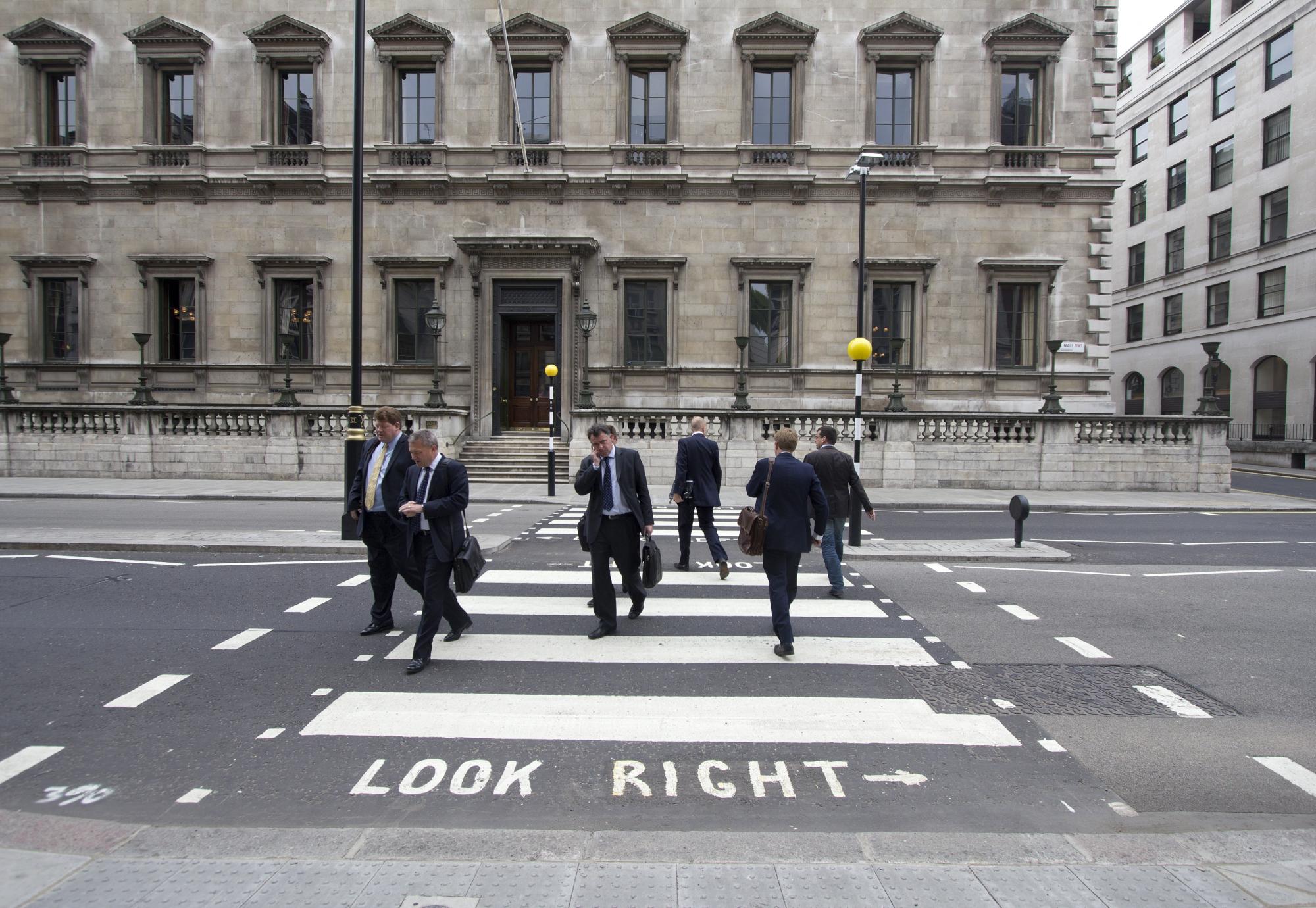 Civil servants crossing the road in London