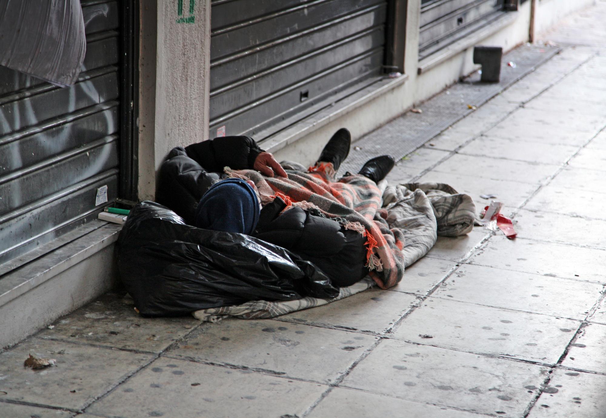 Homeless man sleeping on the street