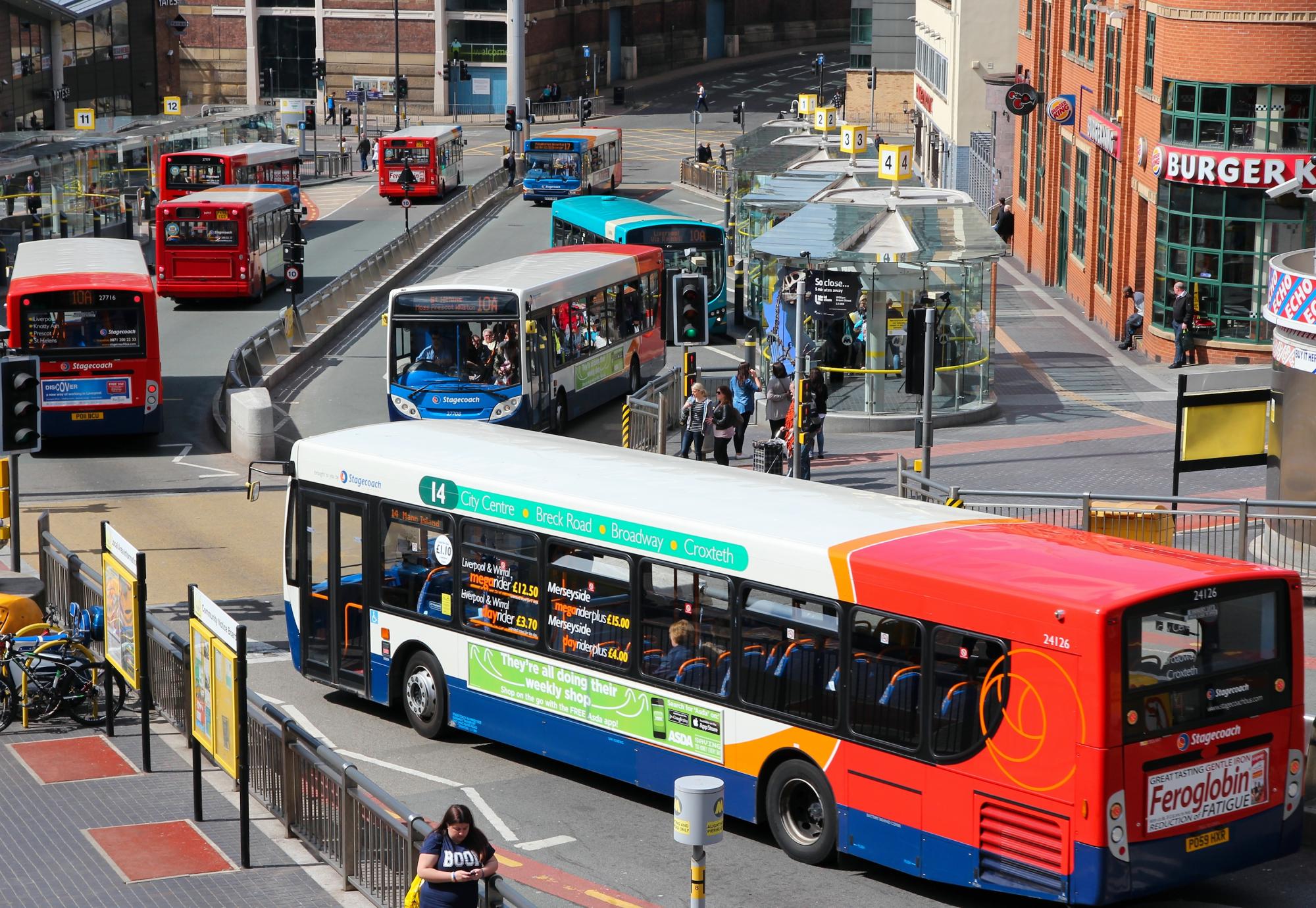 People ride StageCoach buses on in Liverpool, UK.