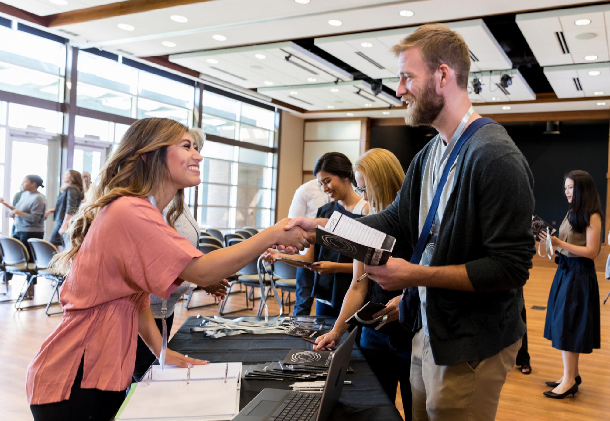 Two people meeting at a careers fair