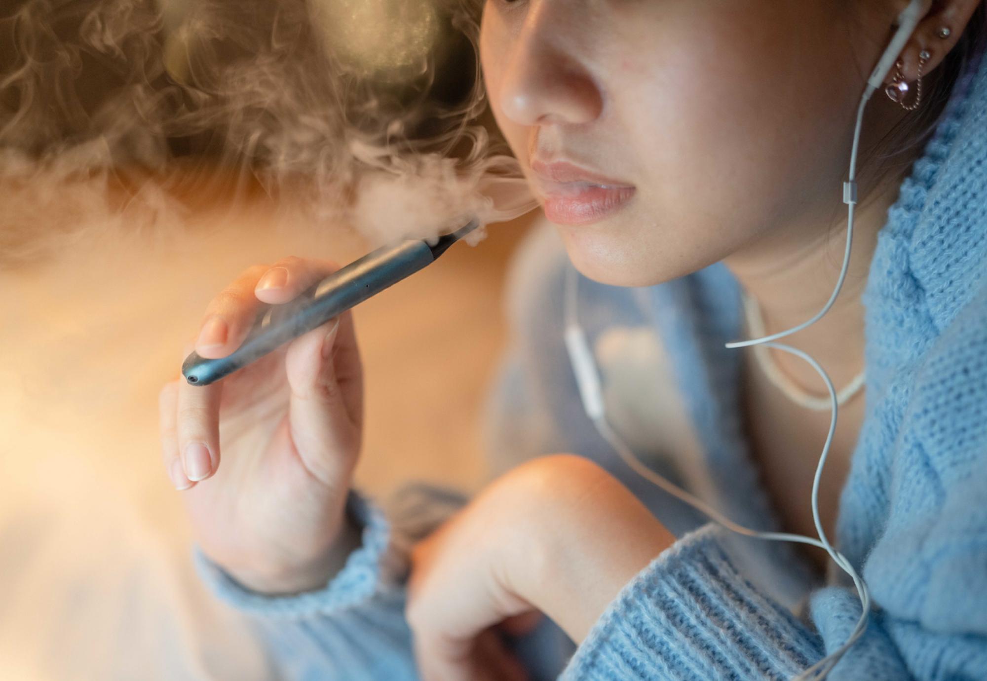 Woman smoking electronic cigarette