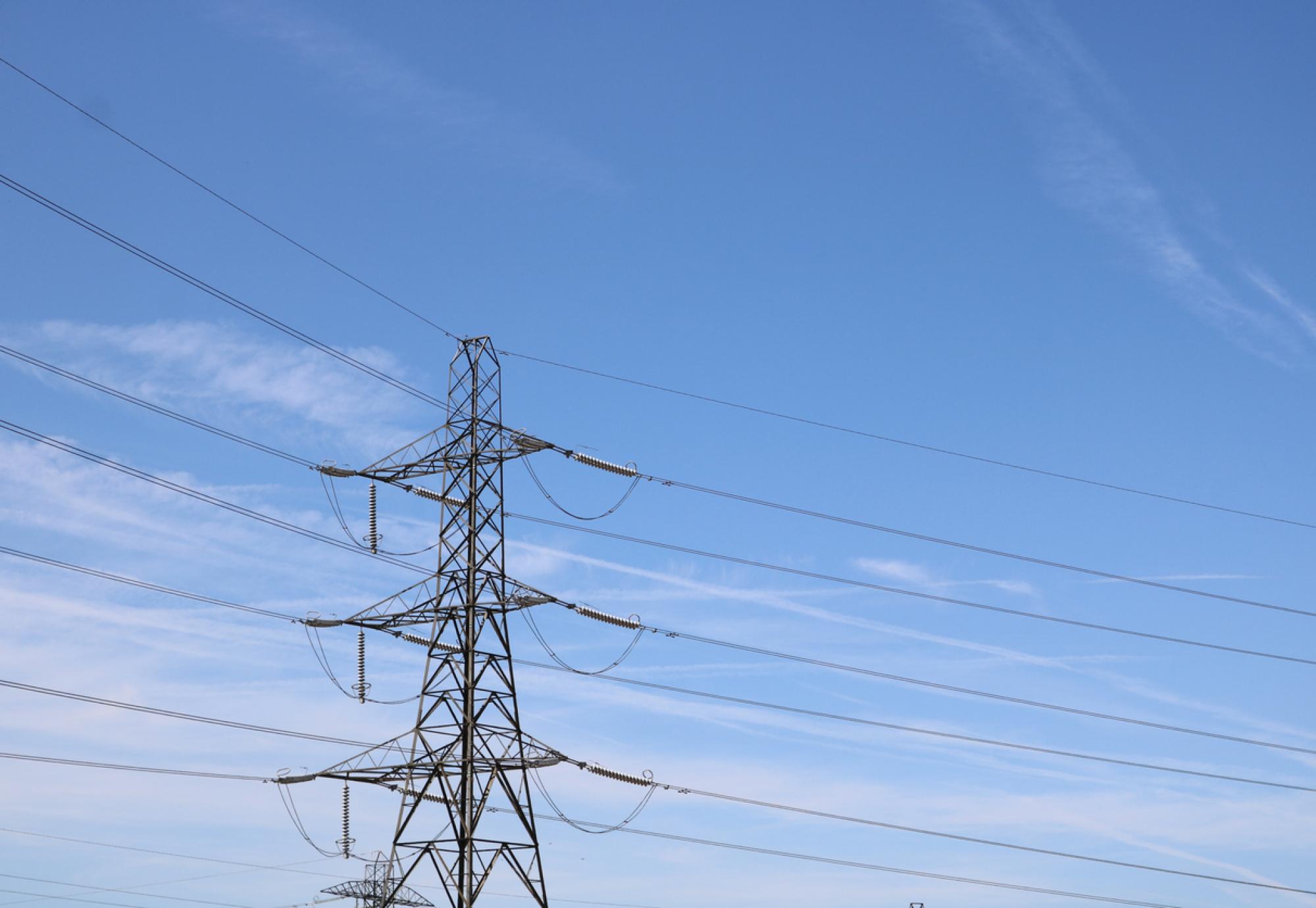 Broadband pylon against soft blue cloudy sky