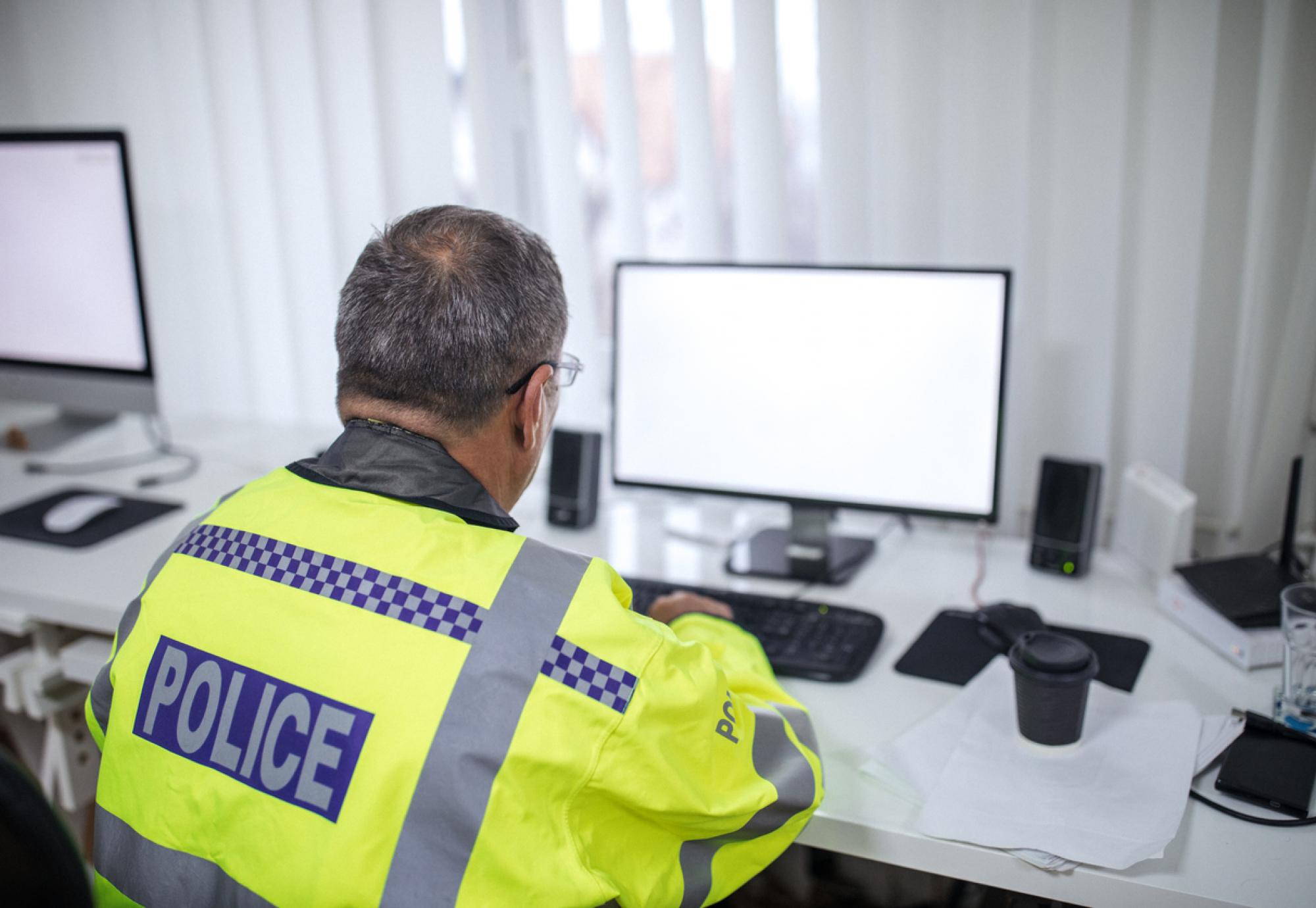 Police officer writing a report