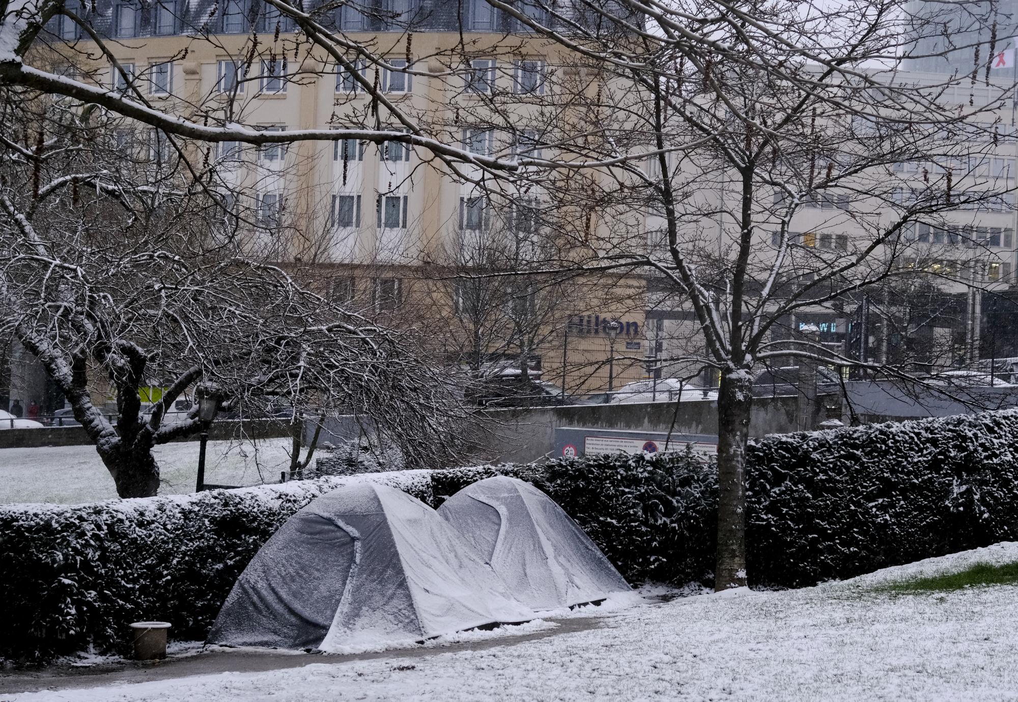 Tents of homeless people as seen in park during a heavy snowfall