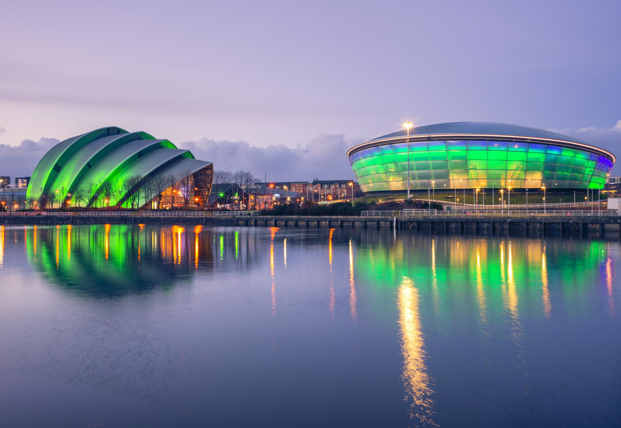 The Scottish Exhibition and Conference Centre Clyde Auditorium and the Scottish Hydro Arena lit up green at night