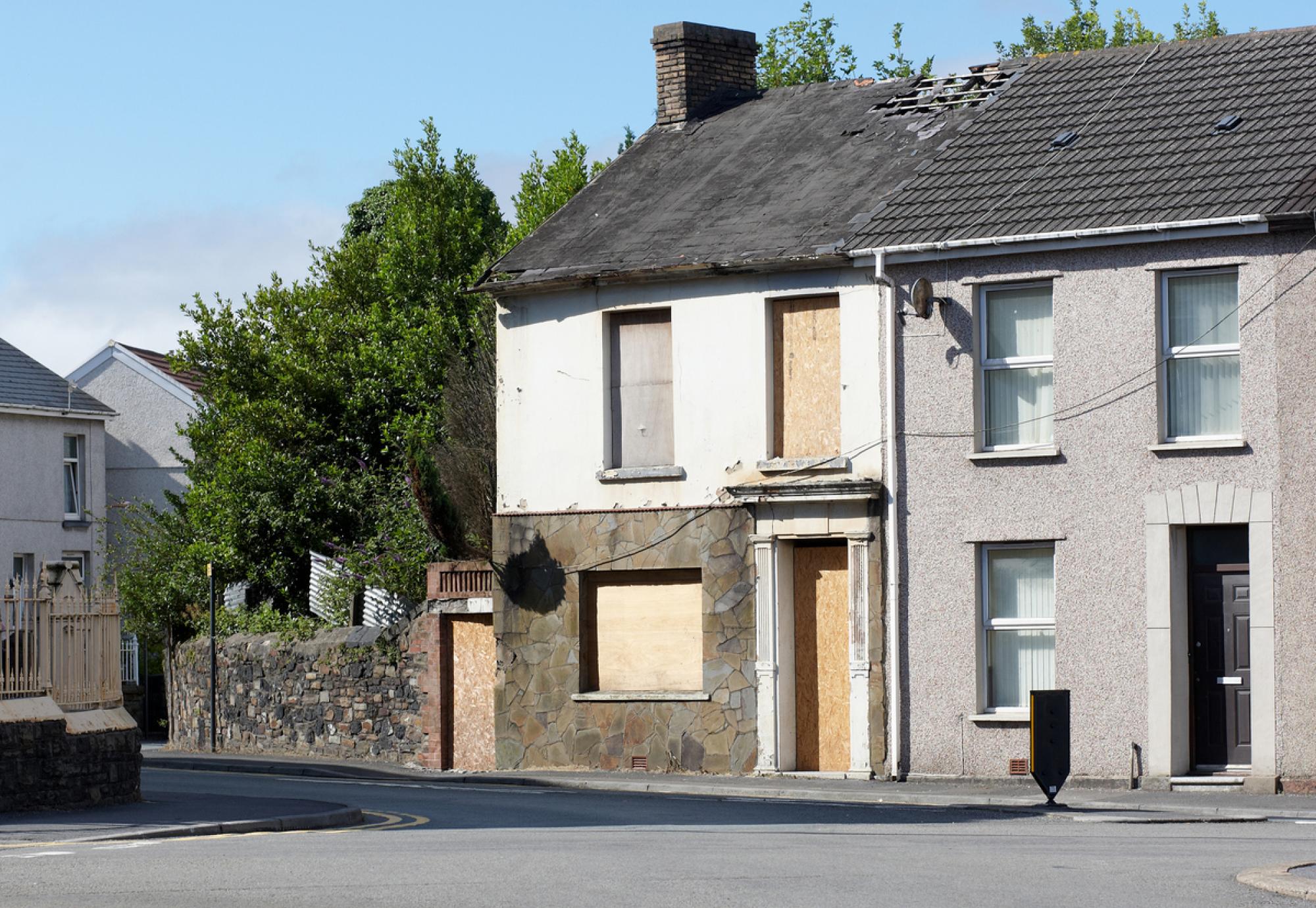 Typical UK terraced housing street derelict