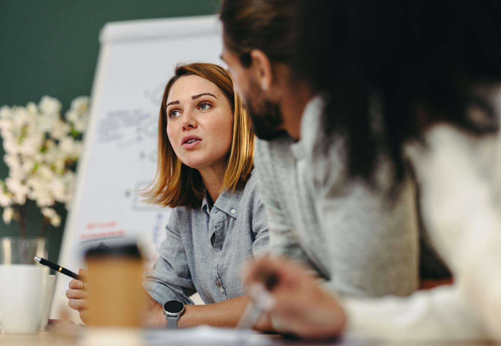 Young businesswoman having a discussion with her colleagues