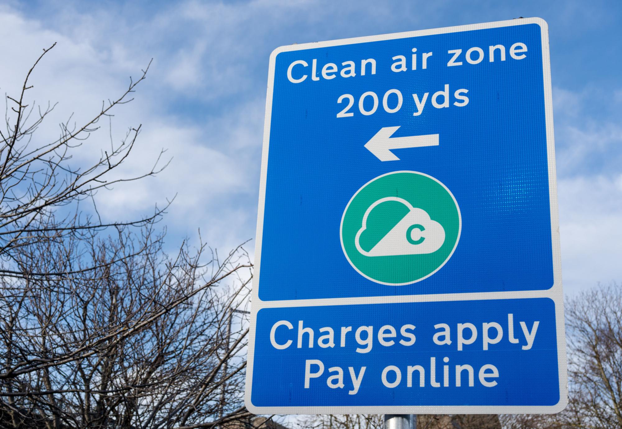 A sign indicates Clean Air Zone (CAZ) charges