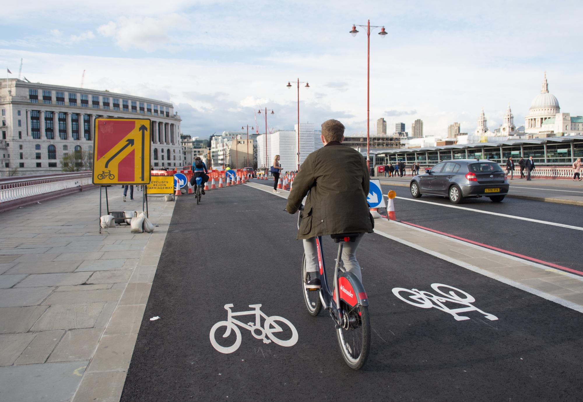 Cyclists using the new TfL Cycle Superhighway on Blackfriars Bridge in central London