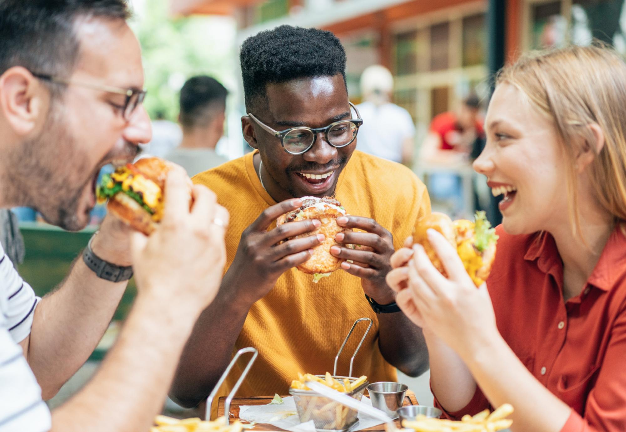 Friends eating burgers and fries