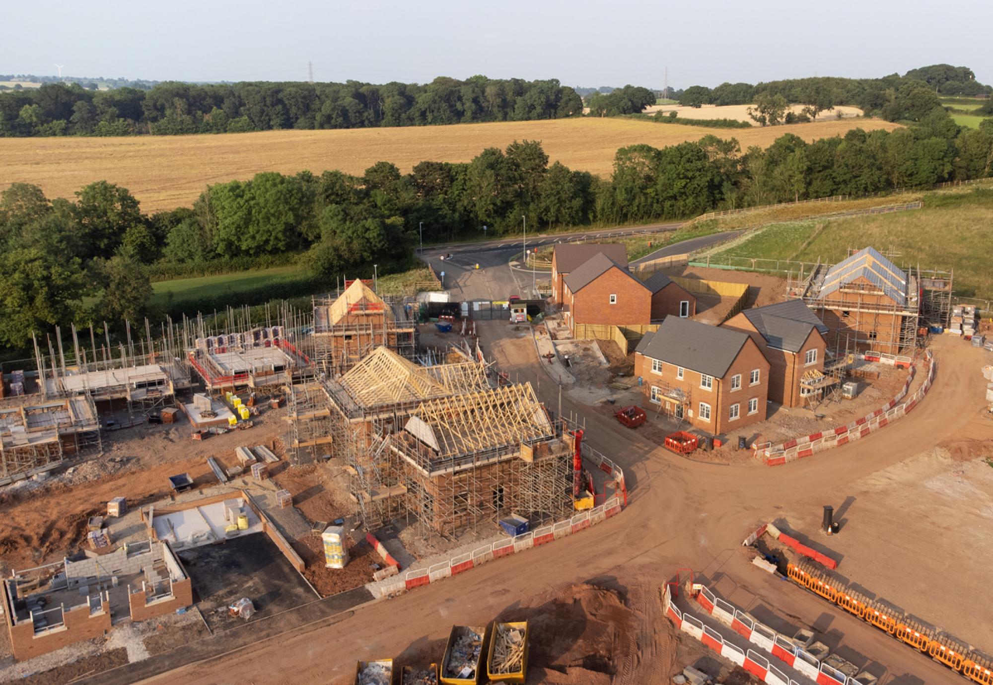 Aerial view looking down on new build housing construction site in England
