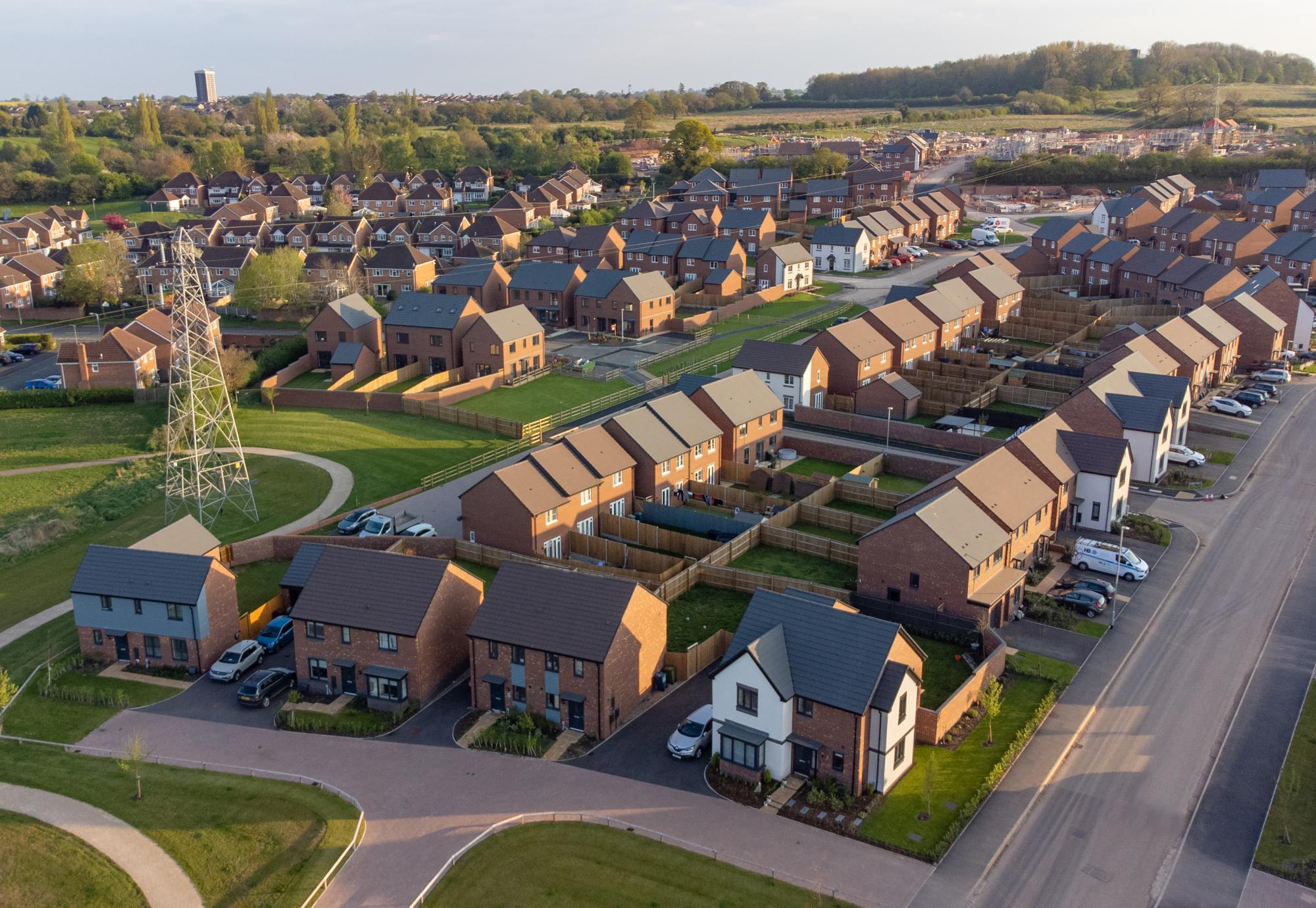 Aerial view of new build housing construction site in England