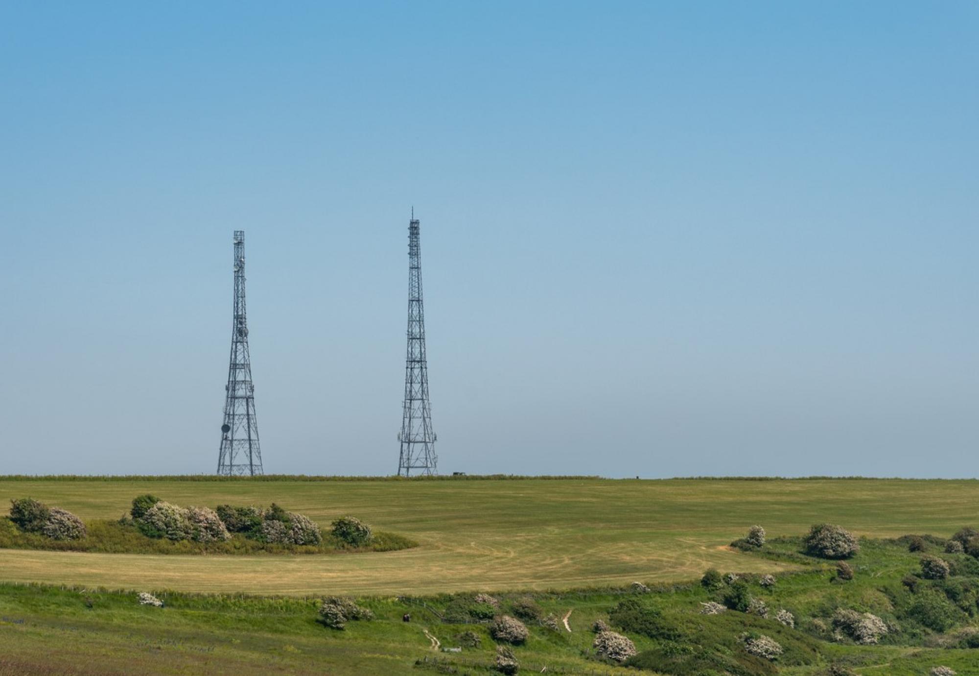 Antenna telecommunication against blue sky.