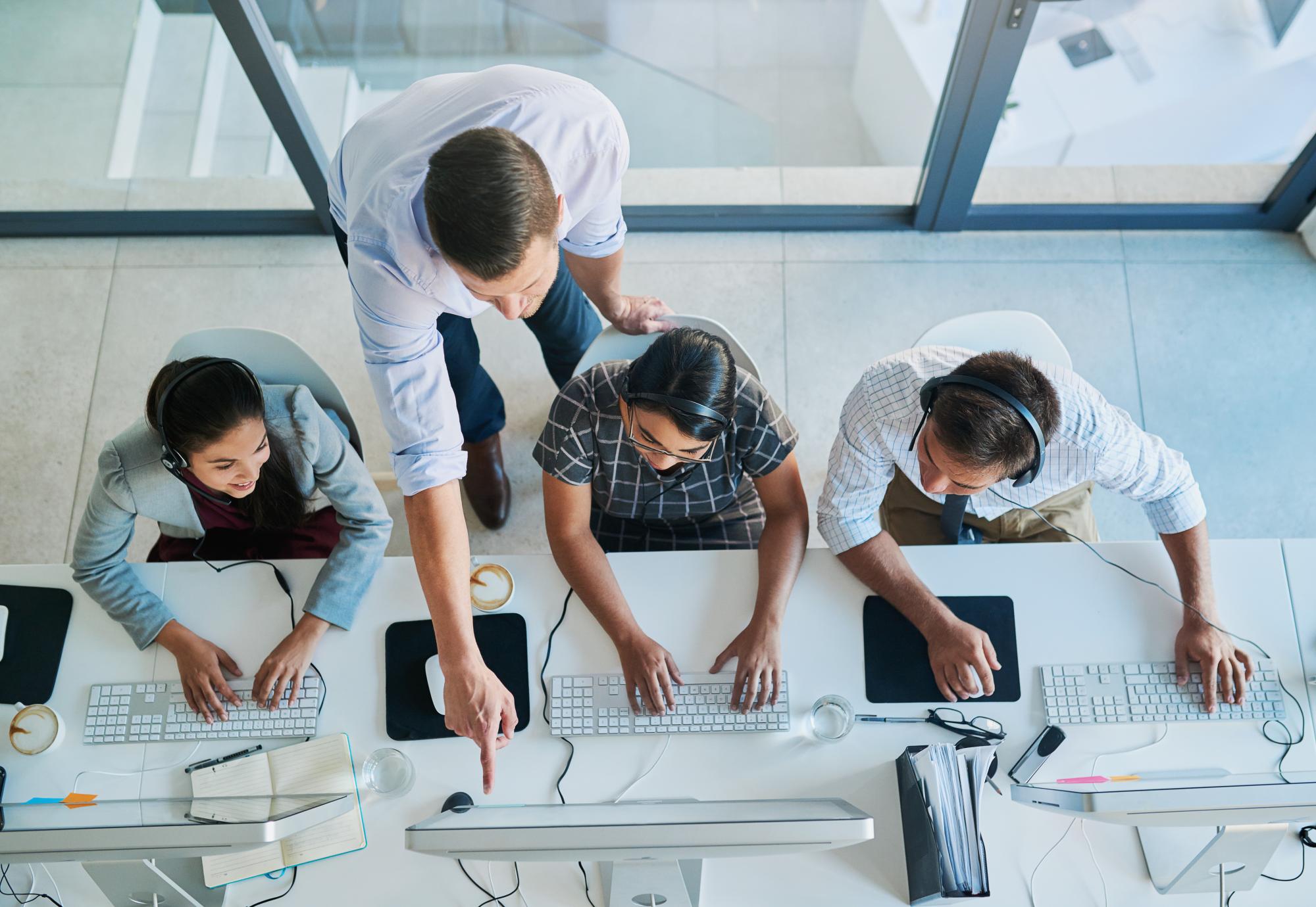 High angle shot of a man assisting apprentices