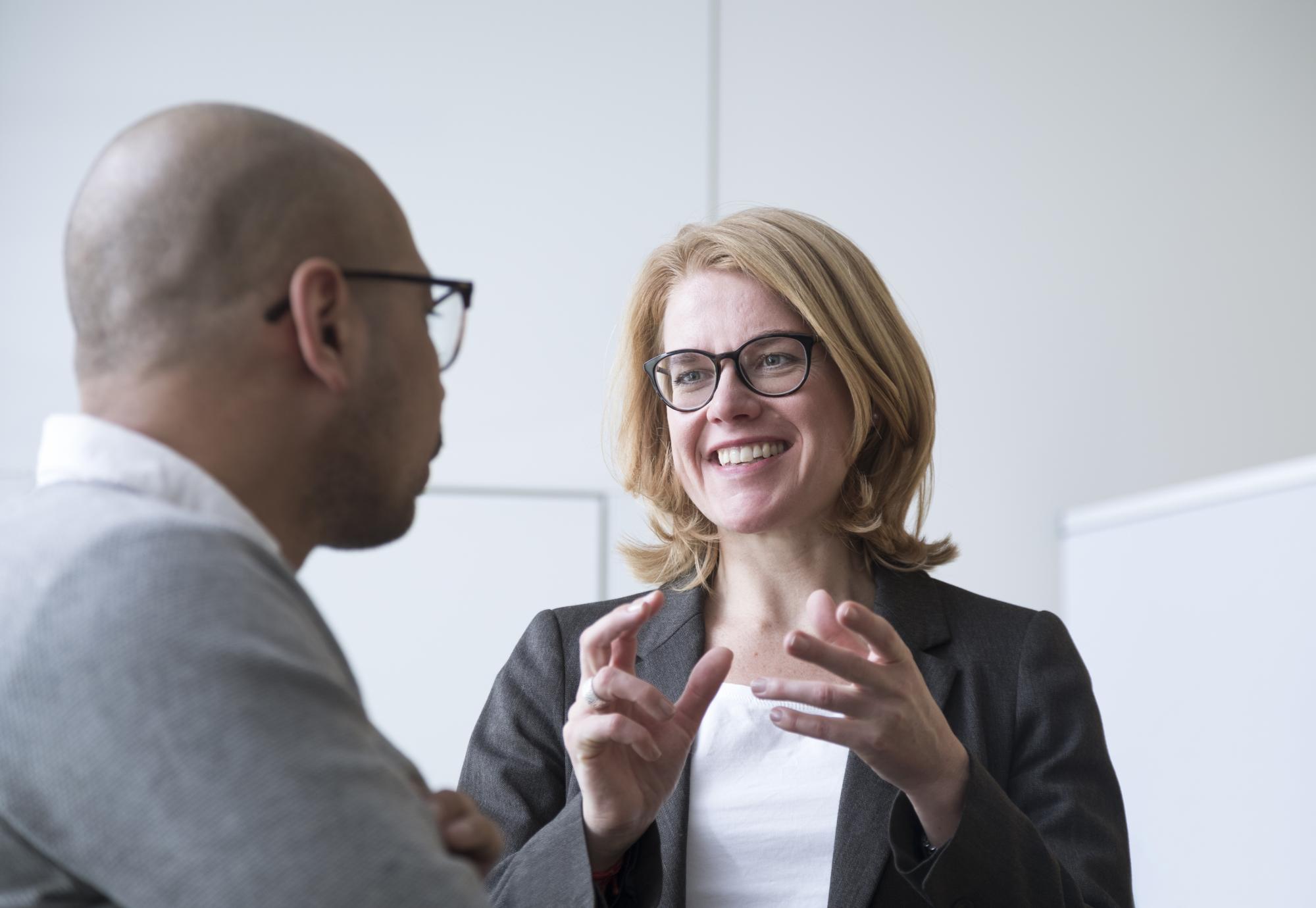 Two people, one of them a CFO, talking and discussing roles