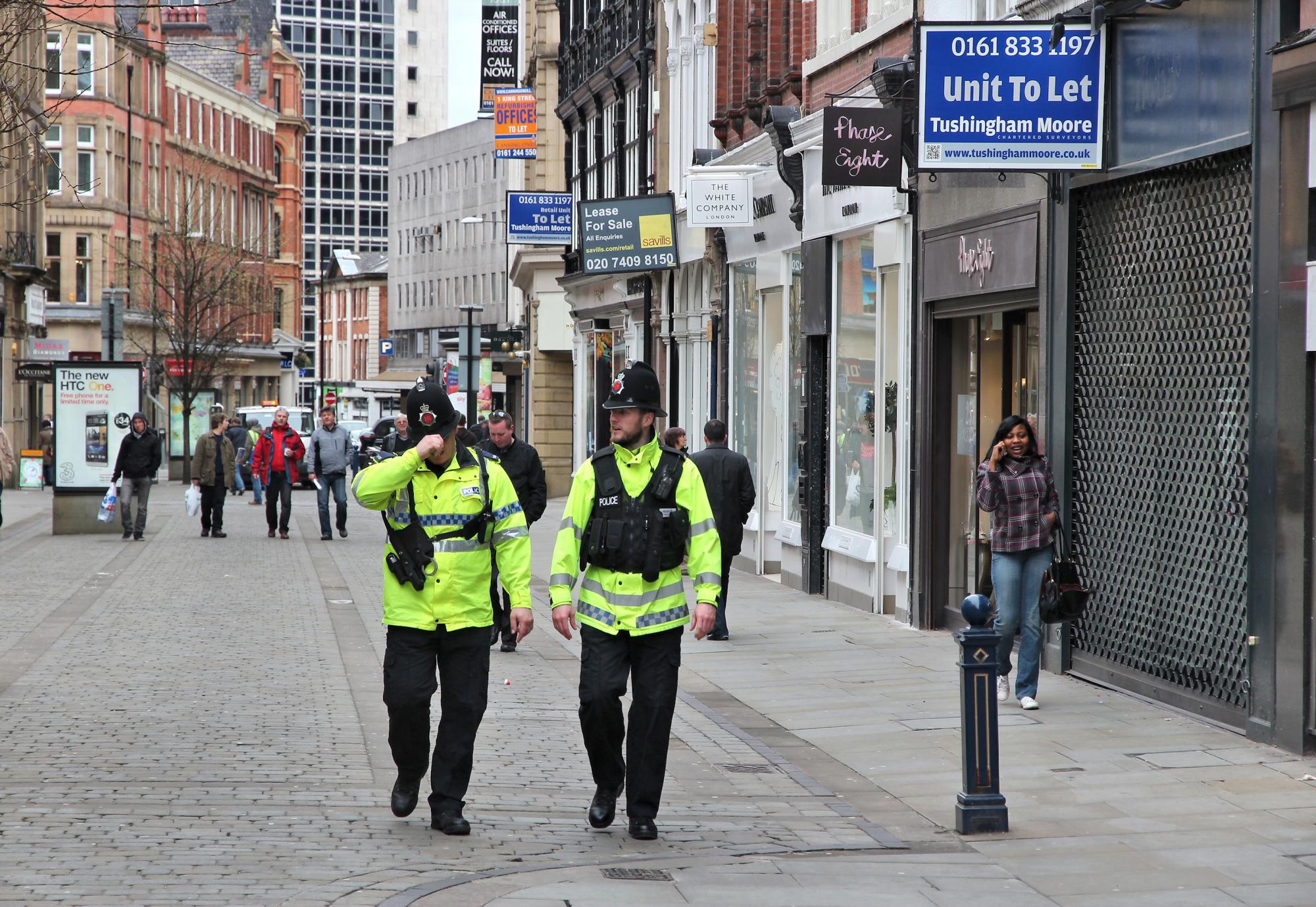 Police officers patrolling streets of Manchester, UK