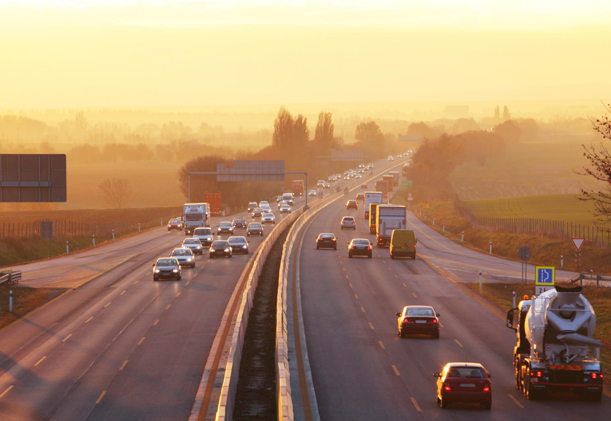 Traffic on highway with cars.