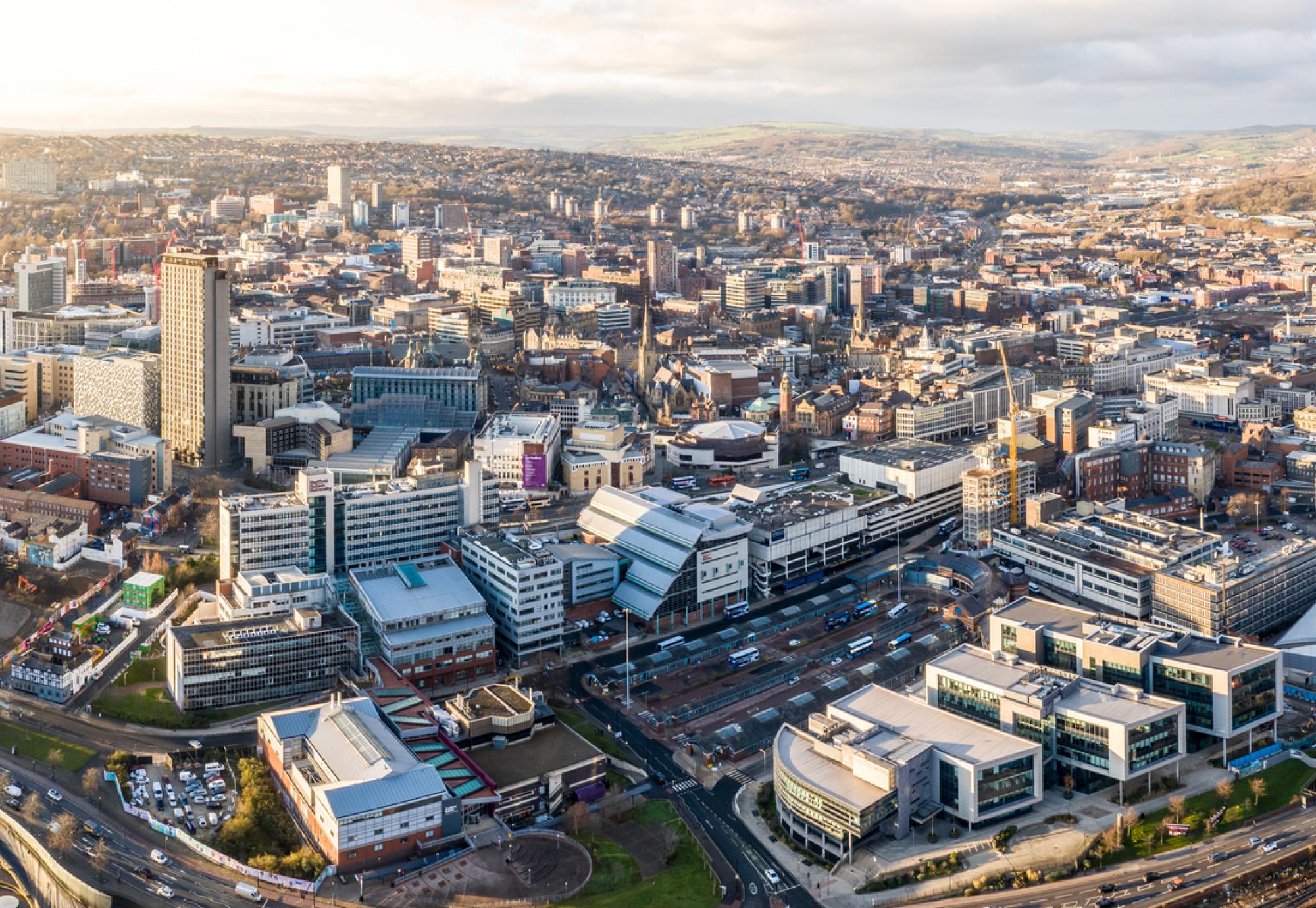 Aerial view of Sheffield city centre skyline at sunset