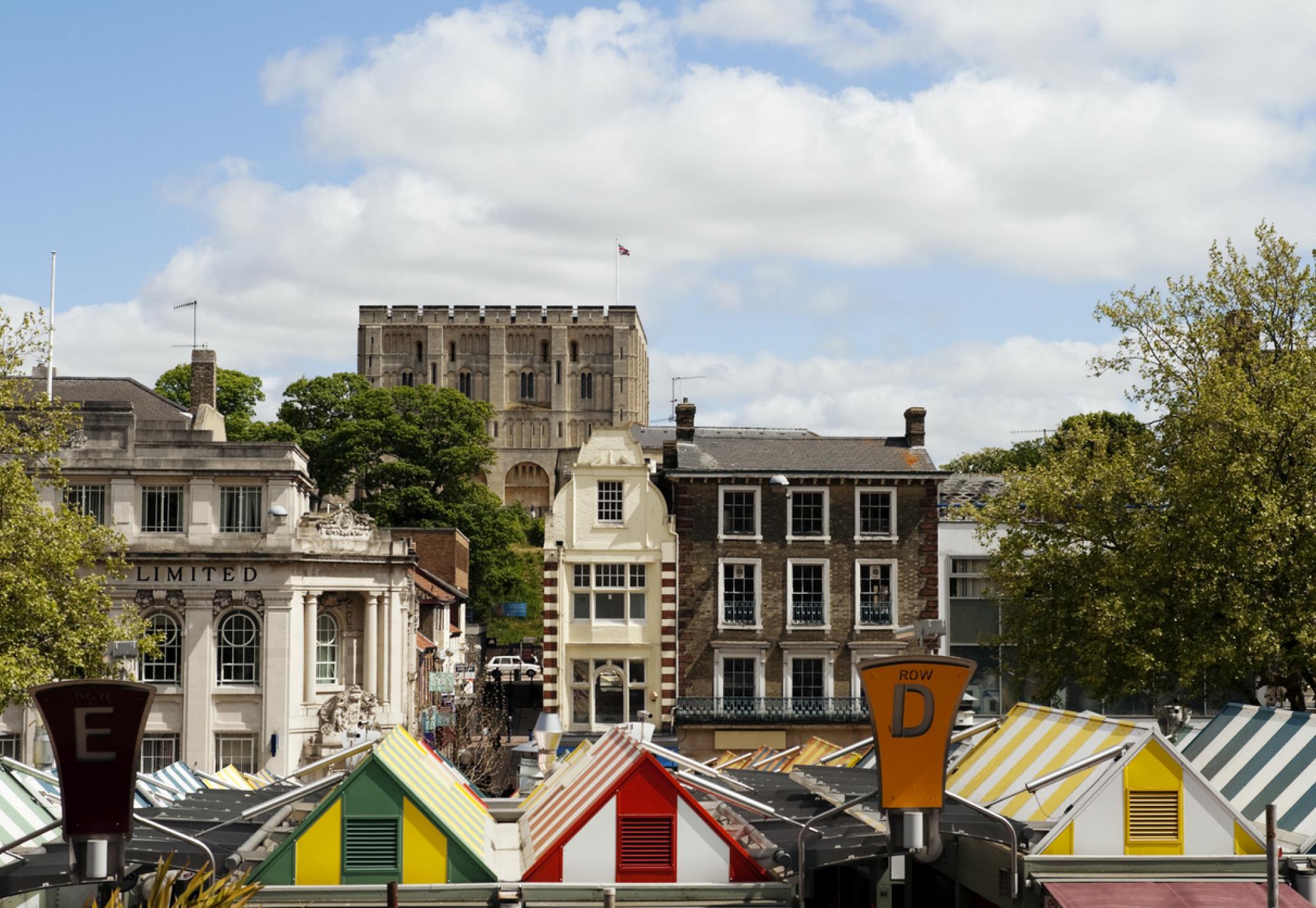The famous market in the centre of Norwich, with Norwich Castle behind.