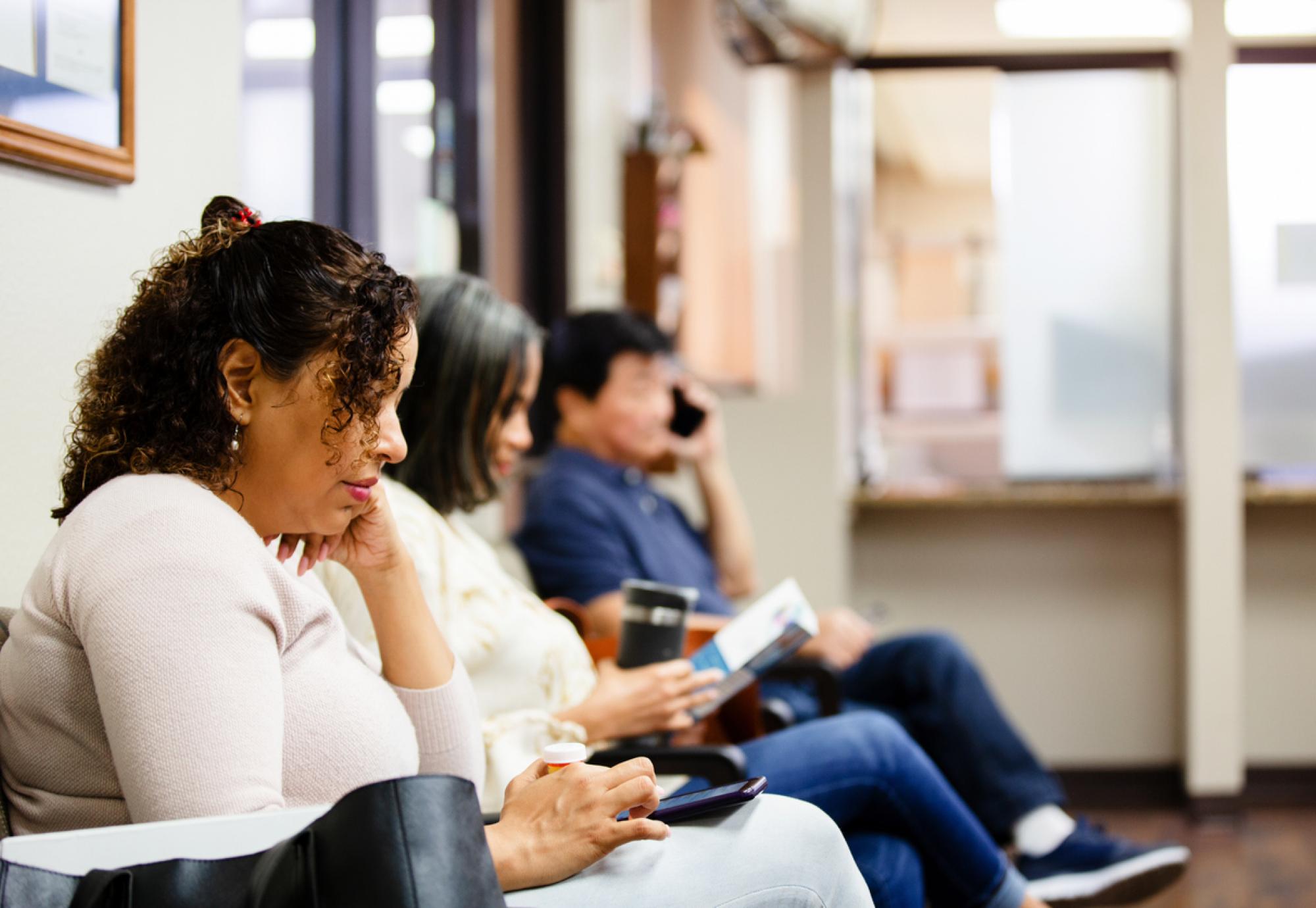 People sit in doctor's waiting room