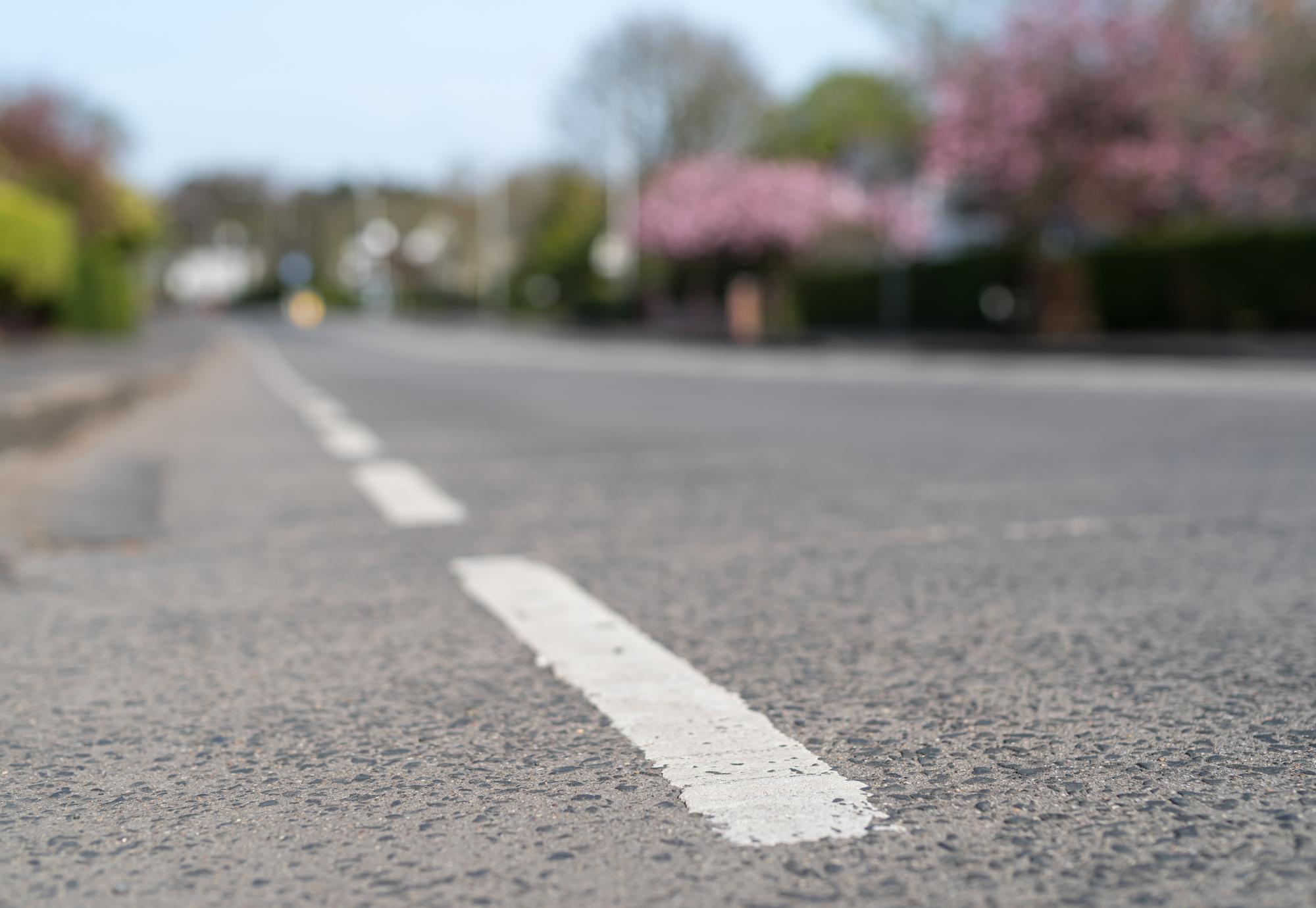 Road markings on an empty suburban road