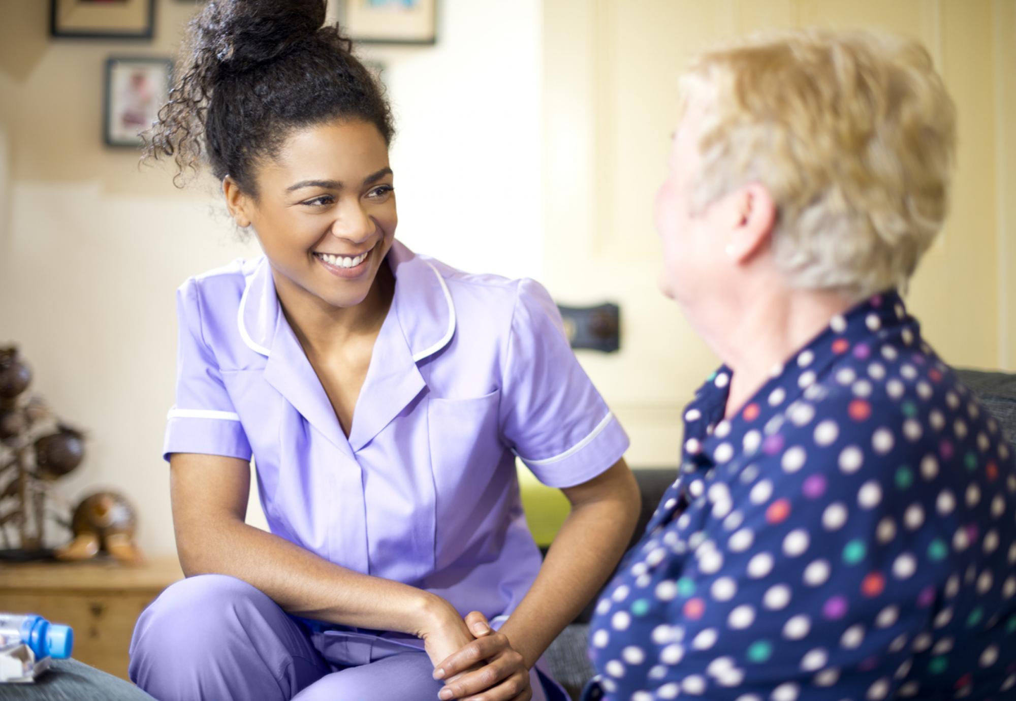 care worker on a house call with an elderly lady