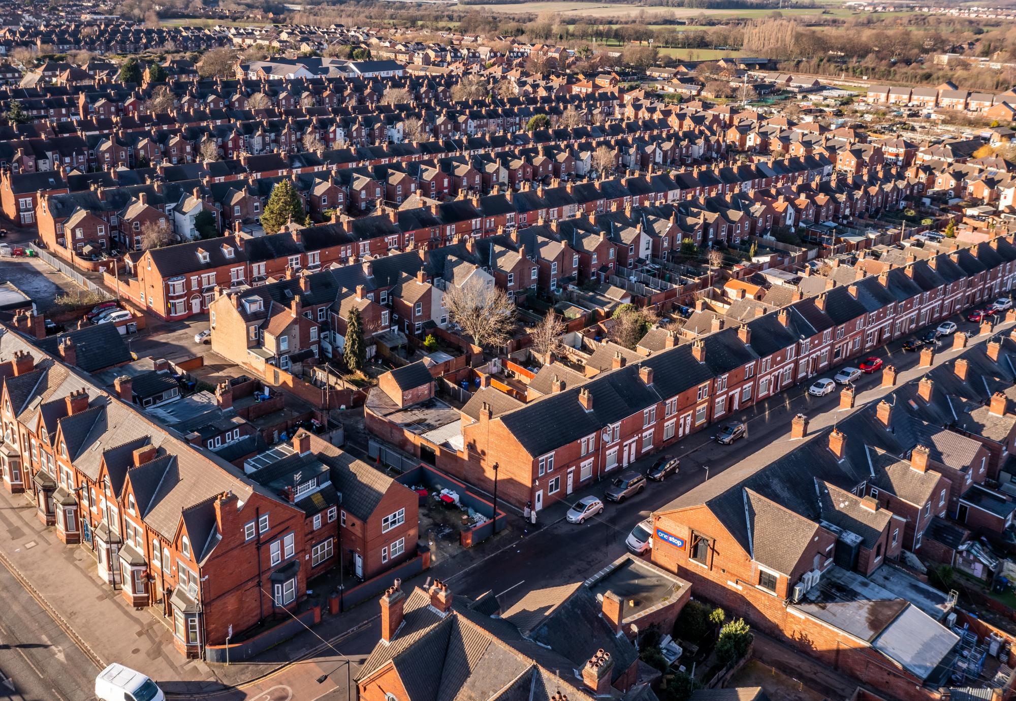 Aerial view of the rooftops of a block of back to back terraced houses in the North of England
