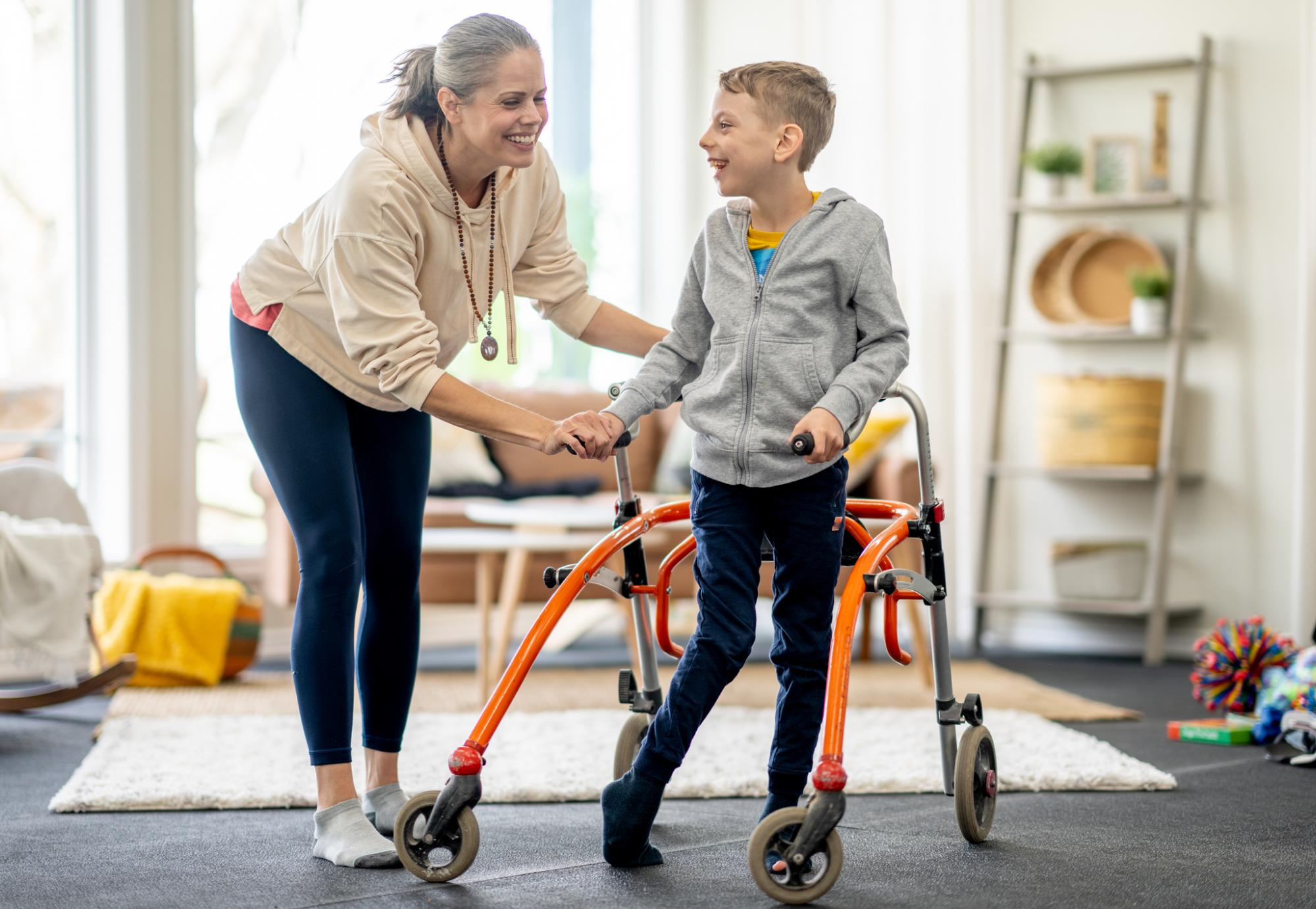 Disabled child with his mother at home